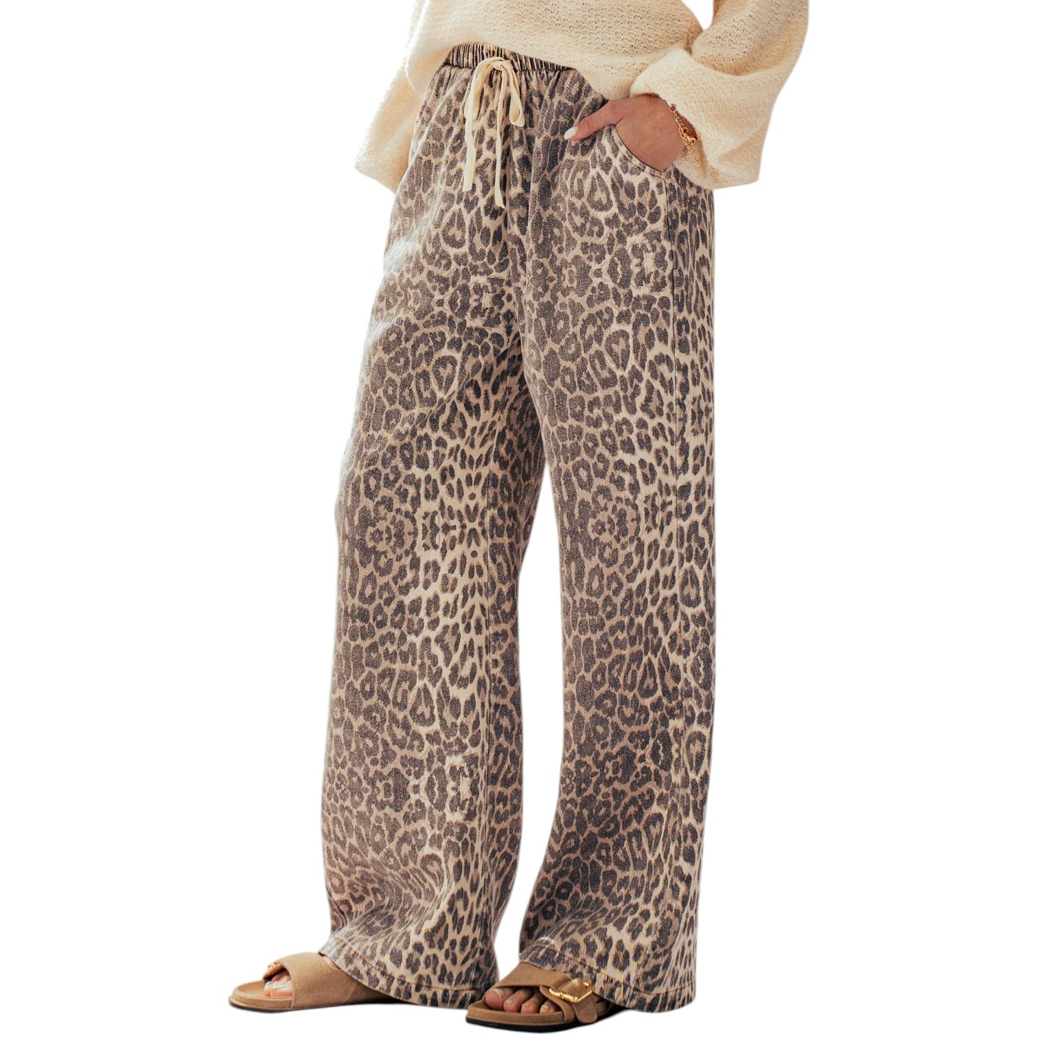 Leopard print pants worn by a person on a white background