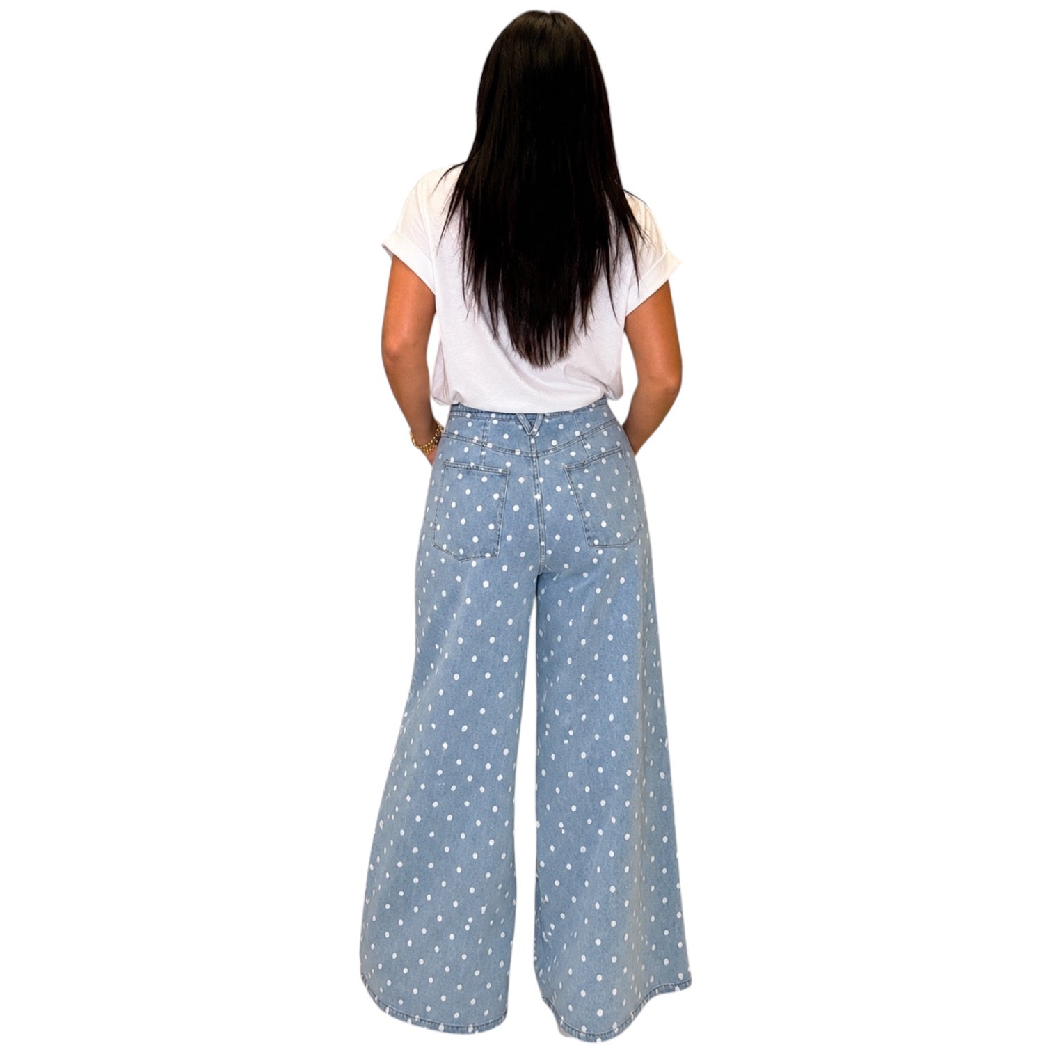 woman wearing light denim polka dot wide leg pants on white background