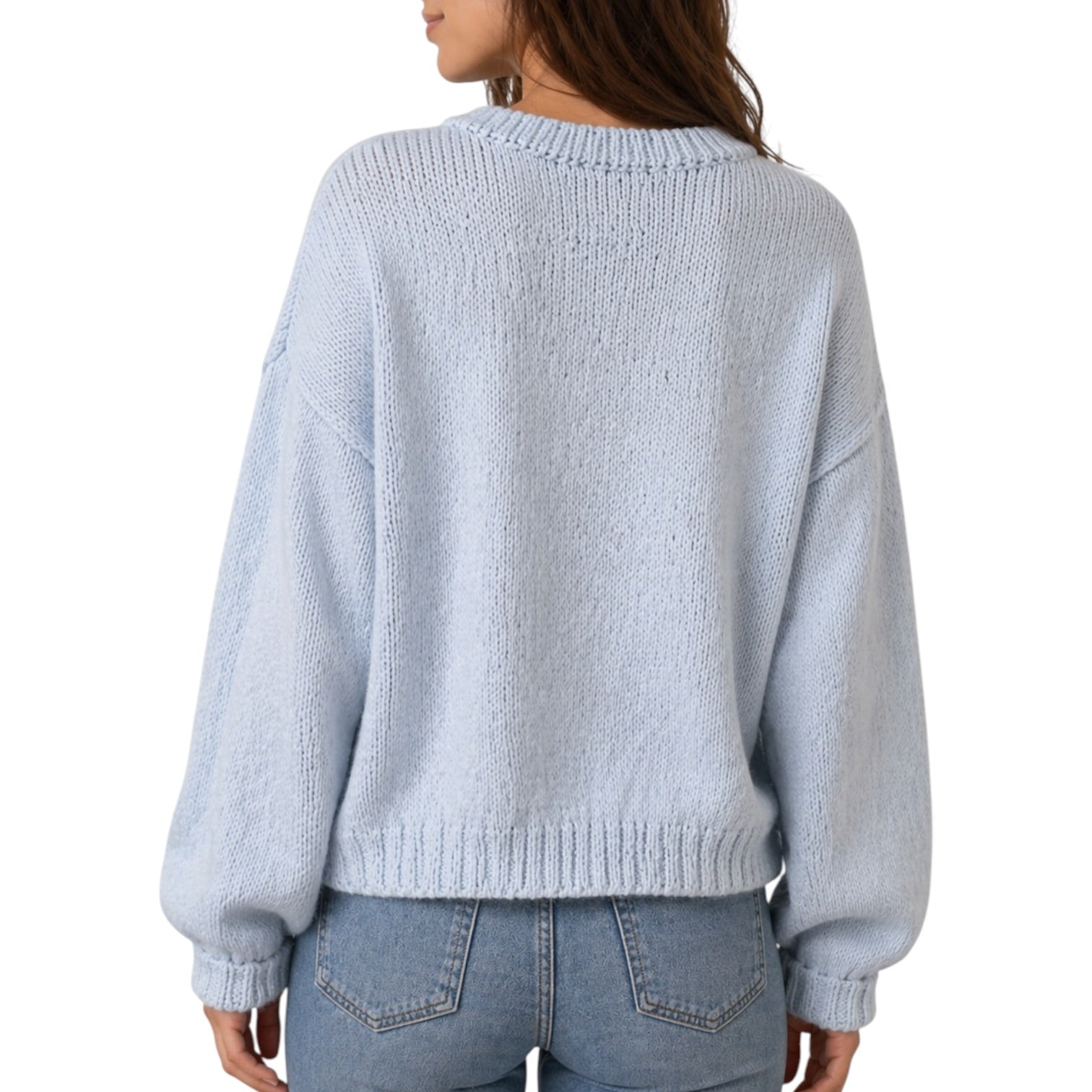 Light blue sweater worn by a person on a white background