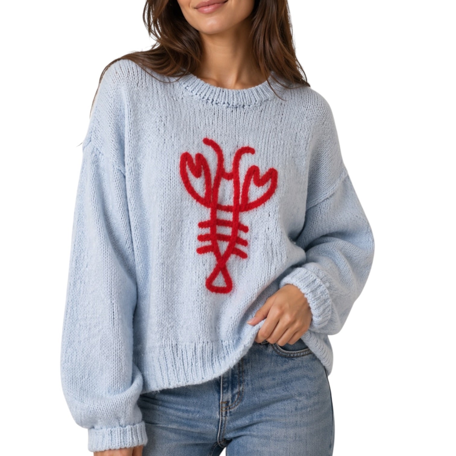 Light blue sweater with red lobster design worn by a person on a white background
