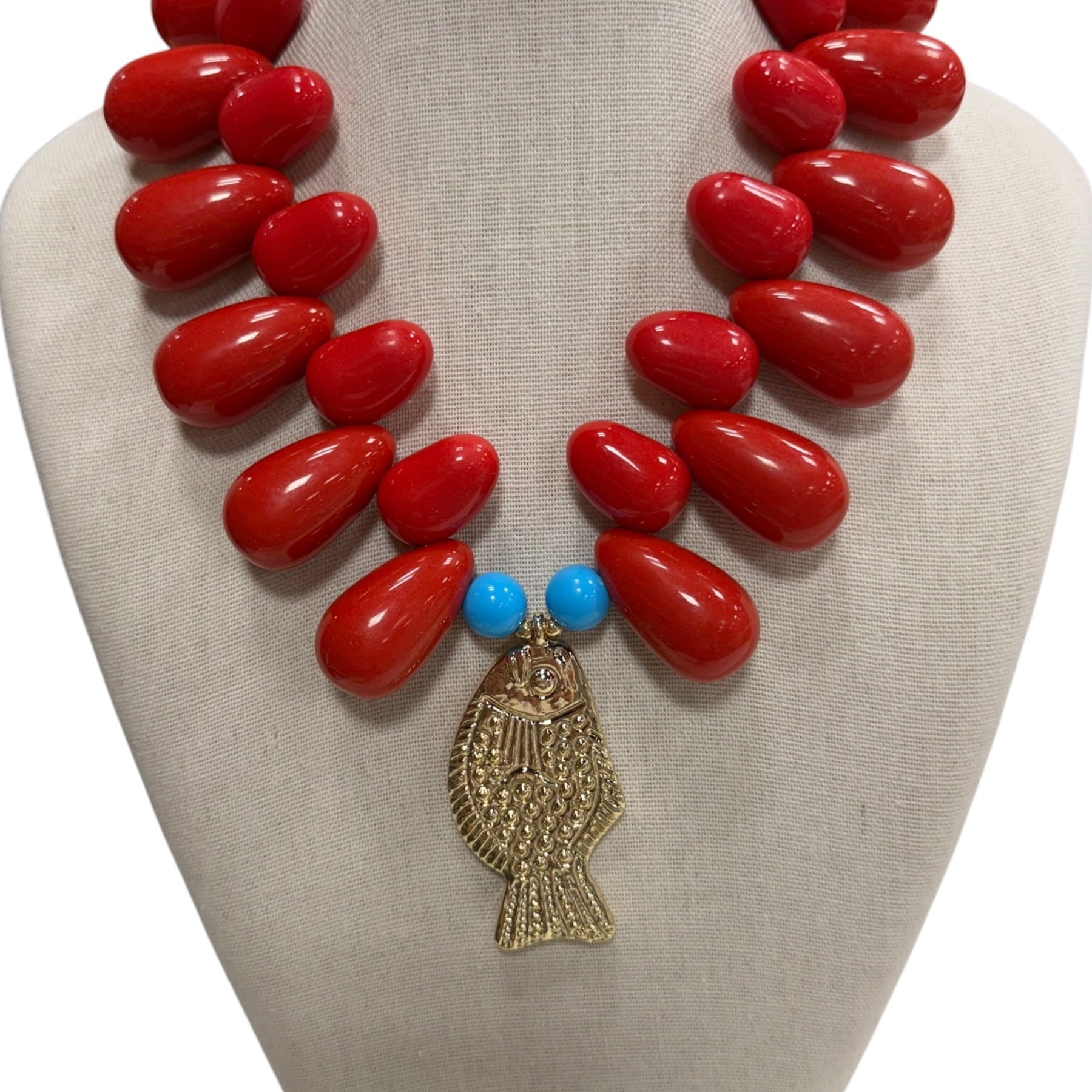 resin beaded fish necklace on white background