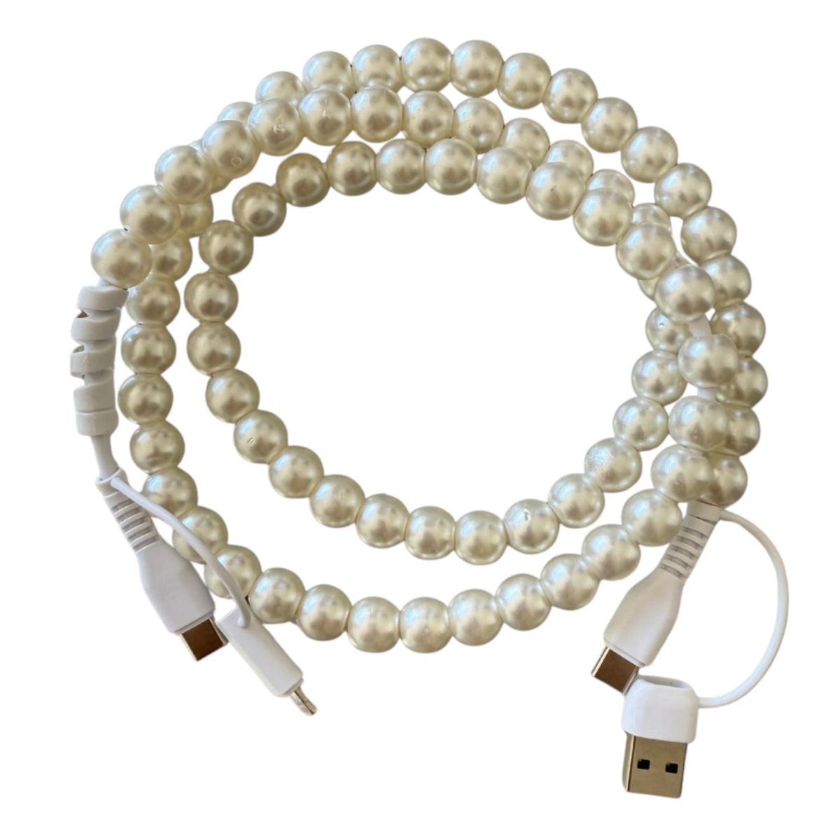 A coiled white USB charging cable decorated with realistic white faux pearls, featuring a USB-A connector on one end and a USB-C connector on the other.