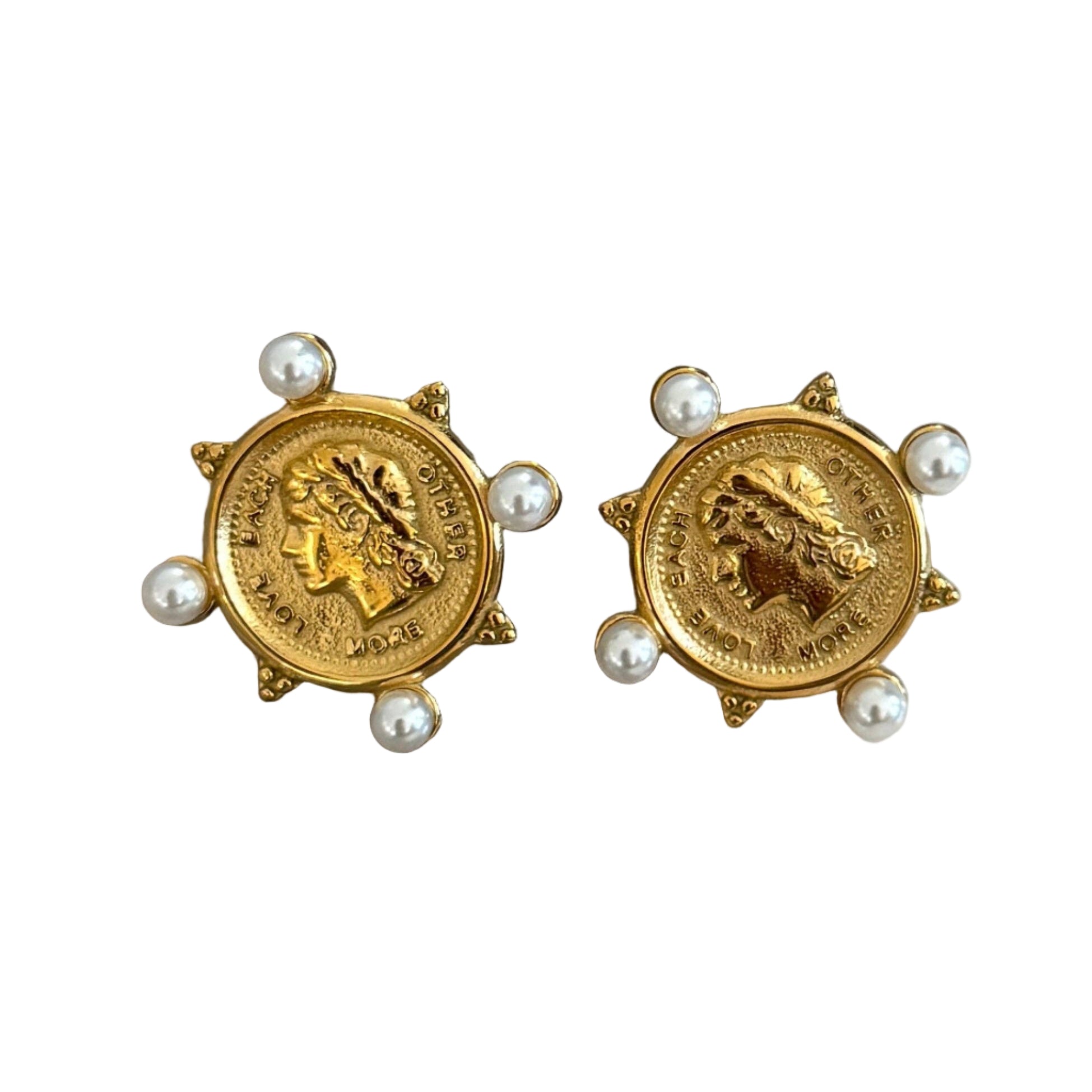 Gold coin-shaped earrings with pearl accents on a white background