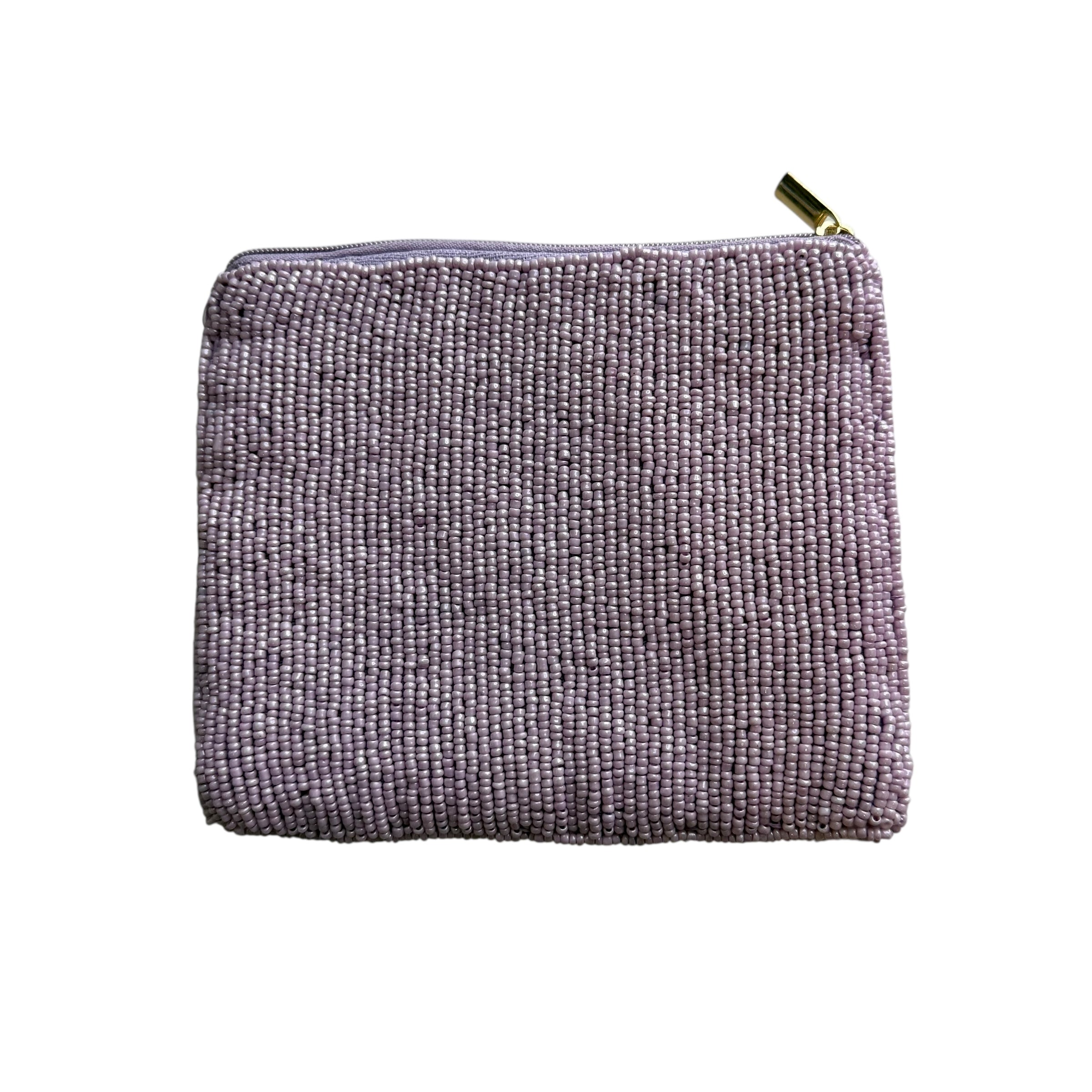 Textured pink pouch with a gold zipper on a white background