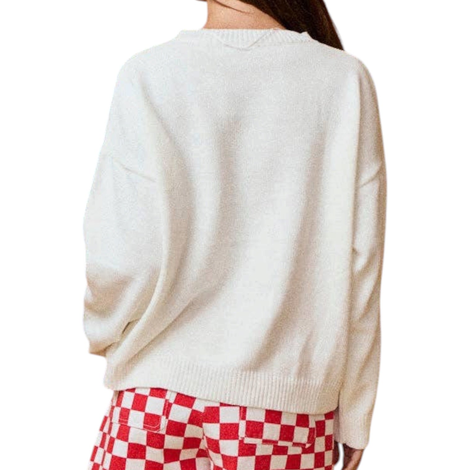 a woman wearing an american flag sweater on a white background