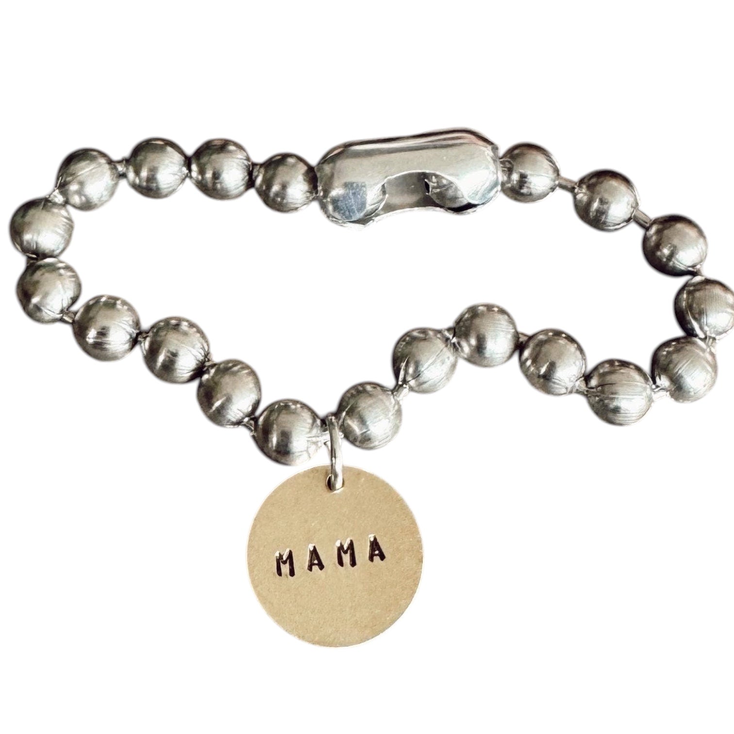 Silver beaded bracelet with a 'MAMA' tag on a white background