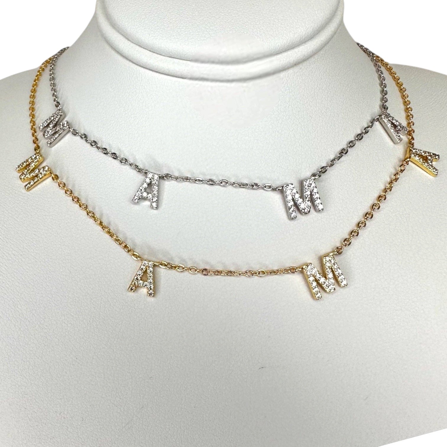 Necklace with letter charms on a mannequin bust