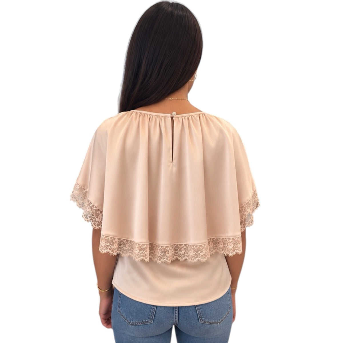 A woman viewed from the back wearing a light peach-beige short-sleeve blouse with lace trim at the shoulders and hem, paired with blue jeans, against a plain white background.