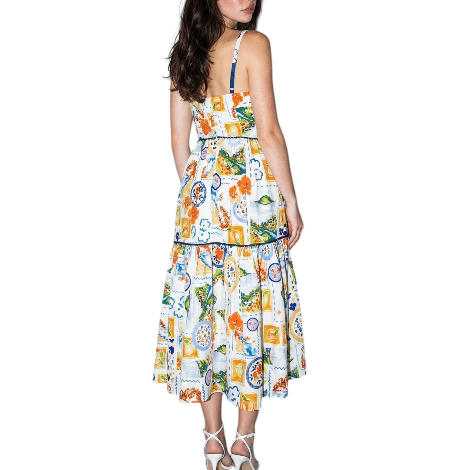 Woman wearing a colorful patterned dress on a white background