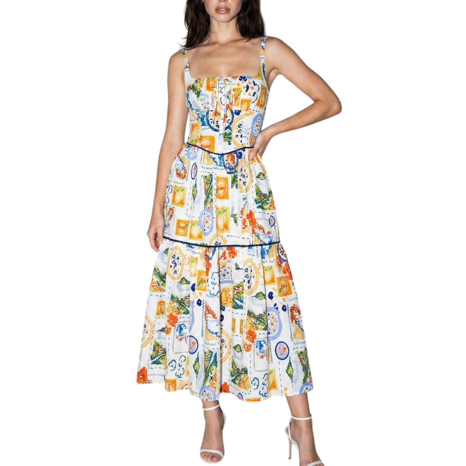 Woman wearing a colorful patterned dress on a white background