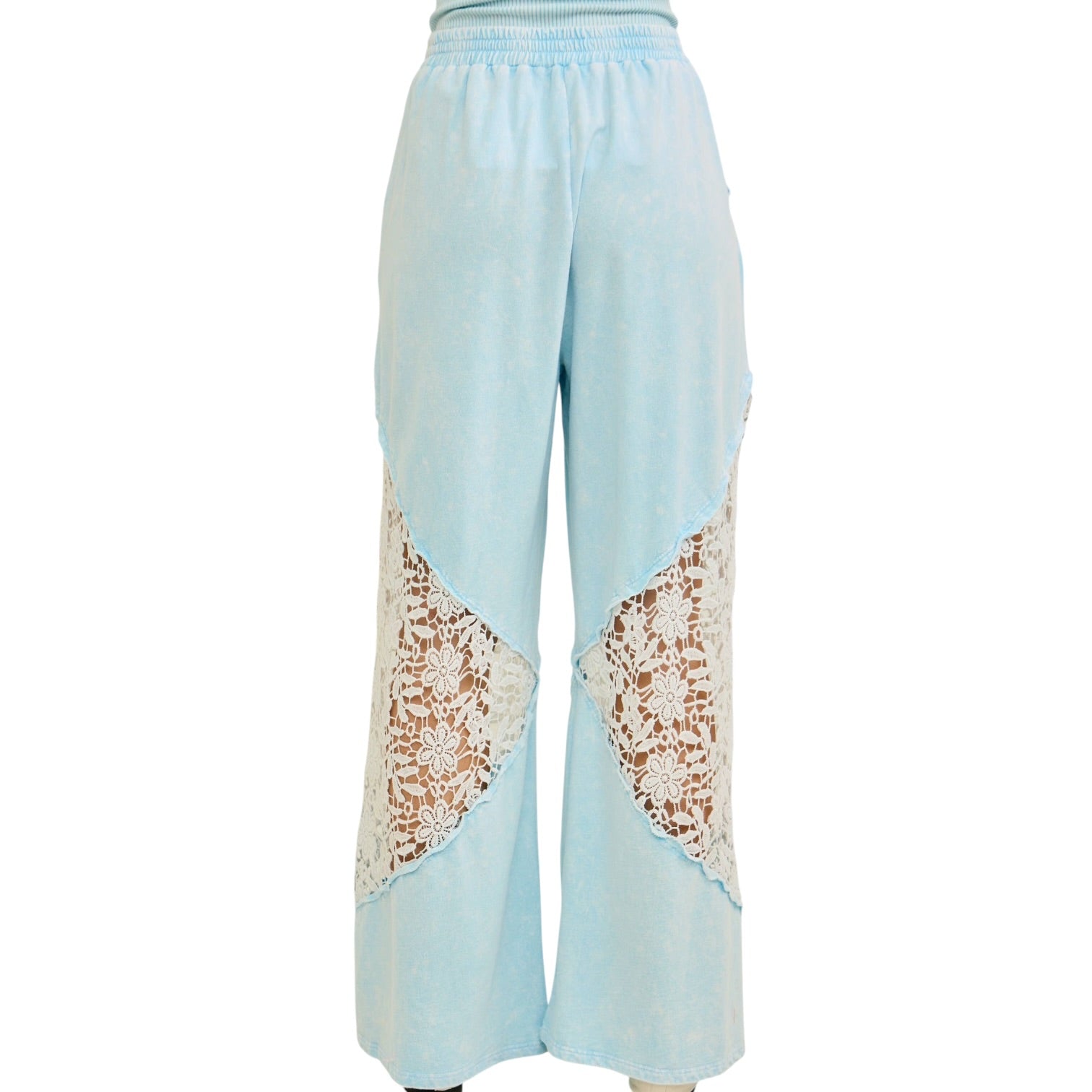 Light blue pants with lace panels on a white background