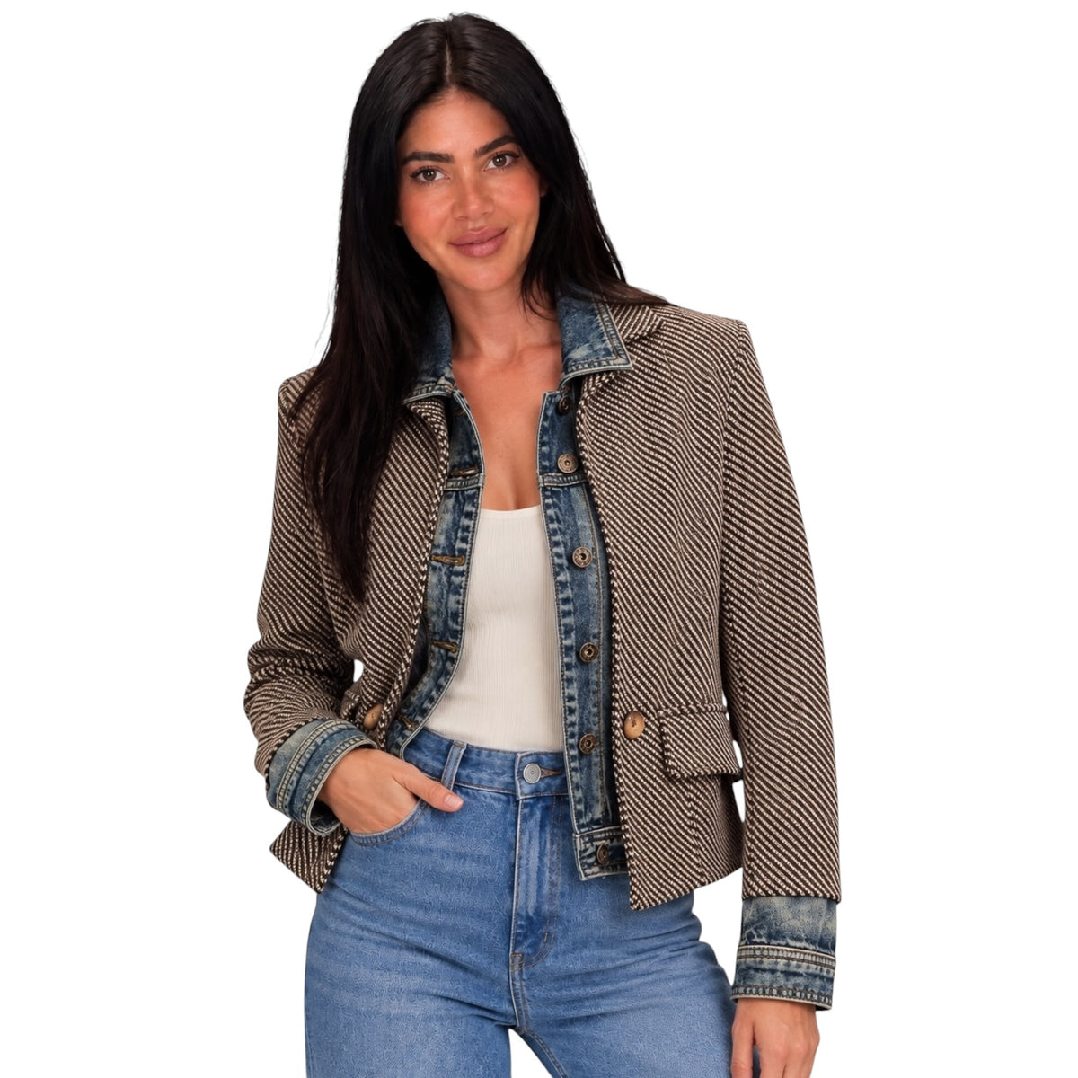 A woman modeling a cropped houndstooth blazer with a denim collar and button front, worn over a white tank top and blue jeans against a plain white background.