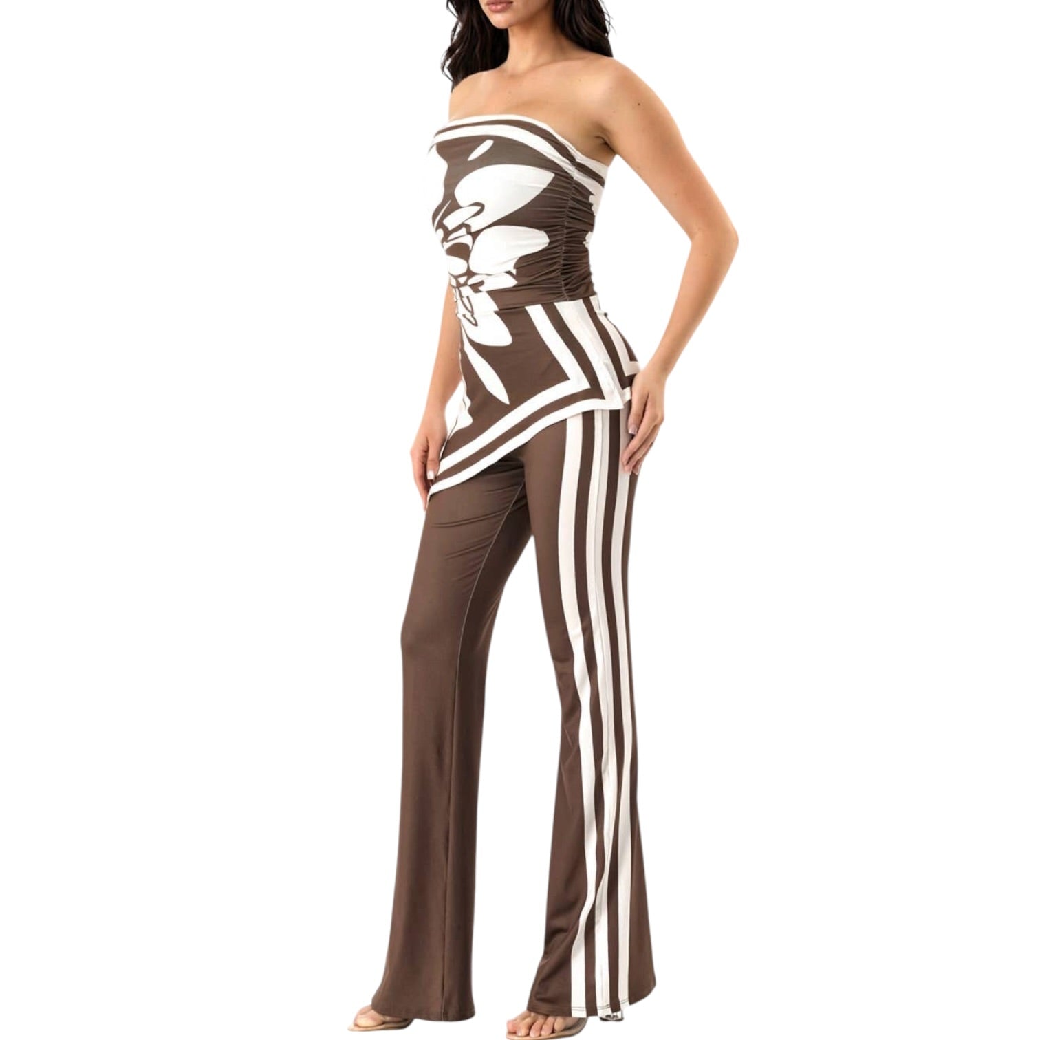 Woman wearing a strapless brown and white outfit with a high-low hem on a white background