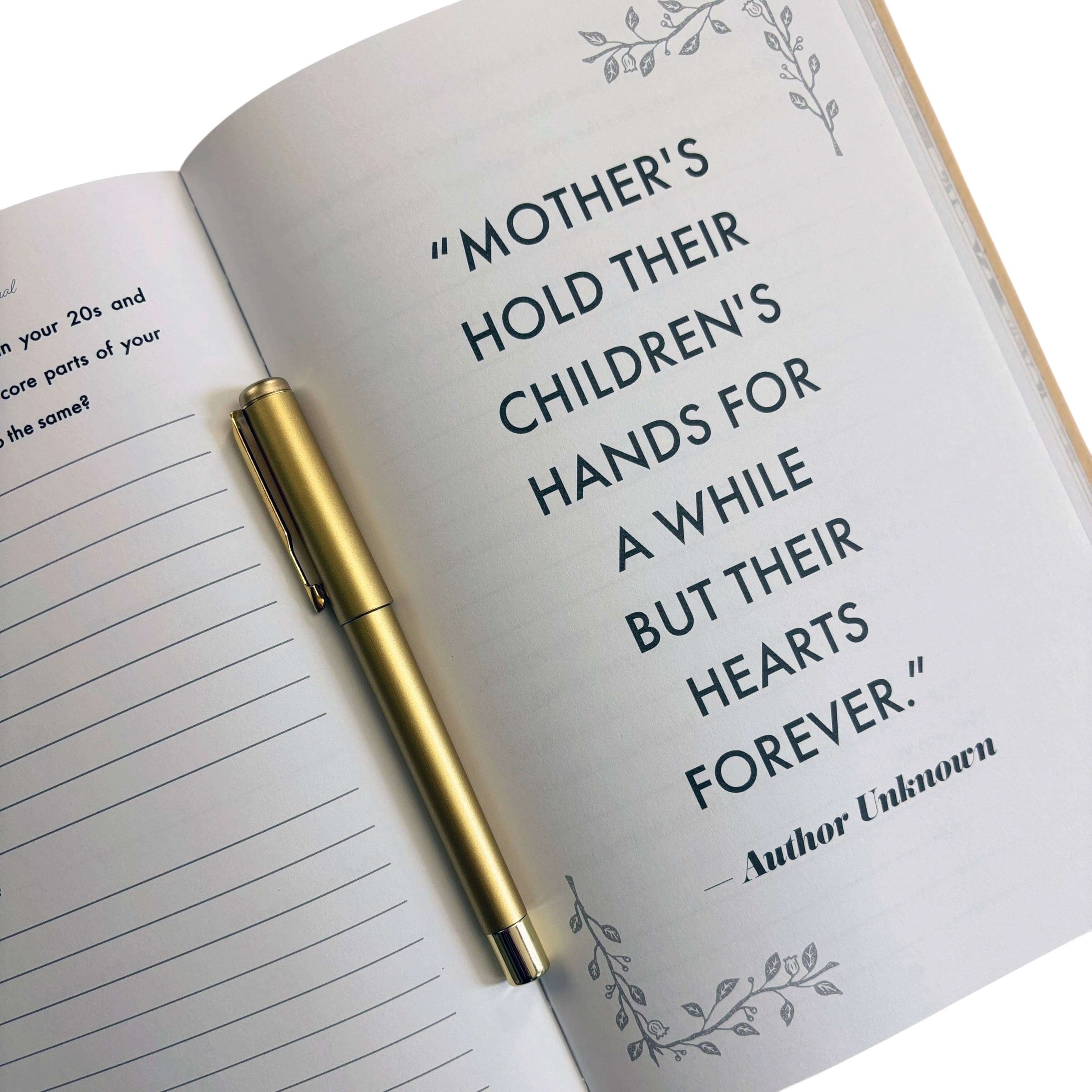 Open notebook with a quote about mothers and children, a gold pen on top, and decorative elements.