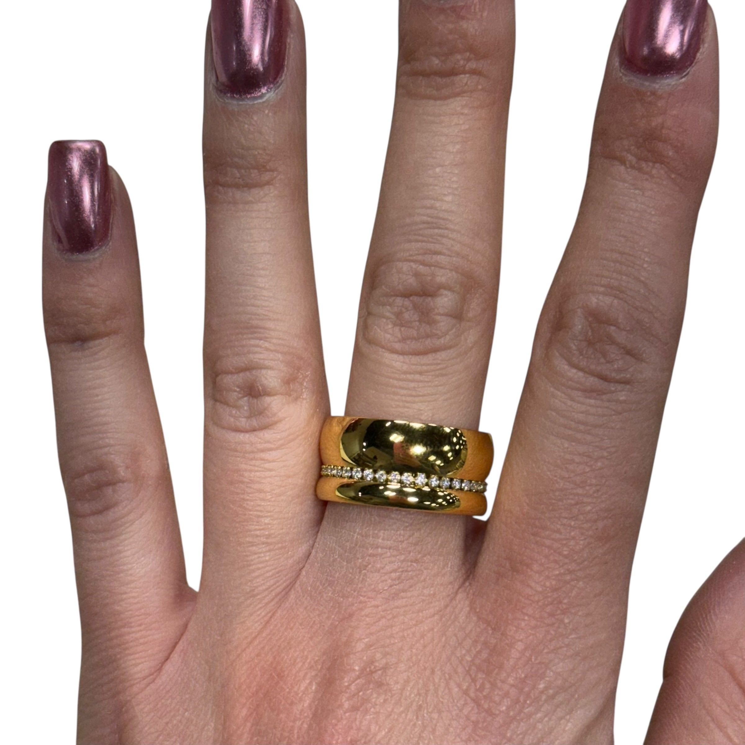 Gold ring on a finger with a white background