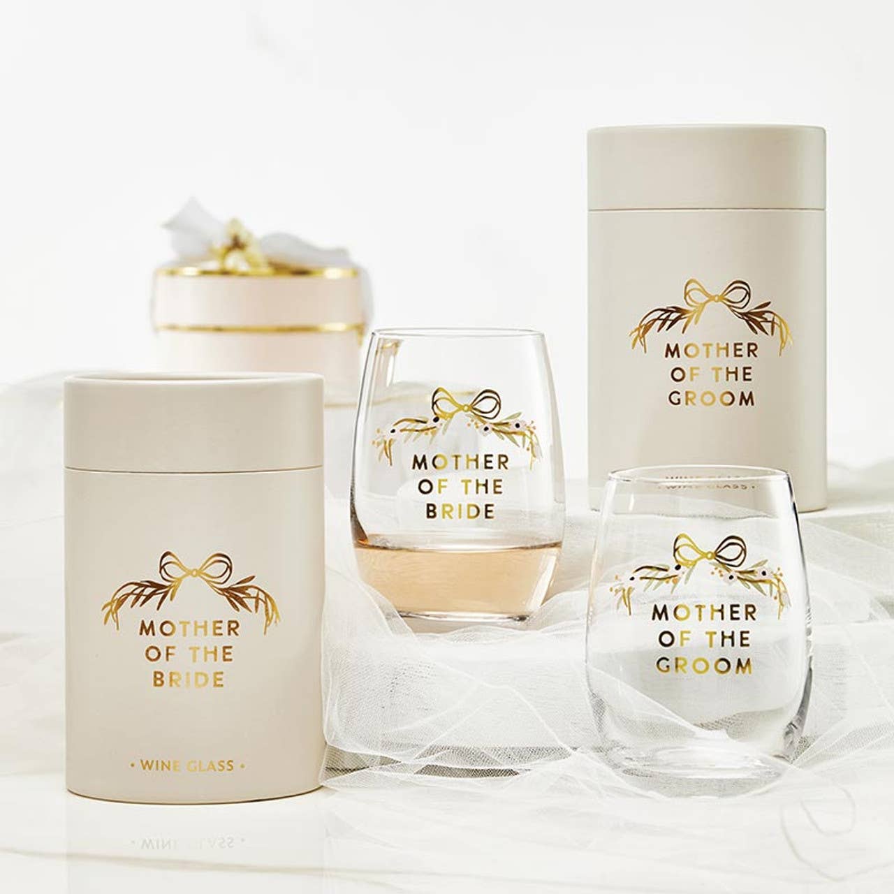 Two wine glasses with 'Mother of the Bride' and 'Mother of the Groom' text, along with matching containers on a white background.