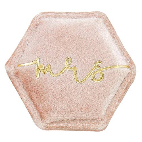 Hexagonal pink ring box with 'Mrs.' in gold on a white background