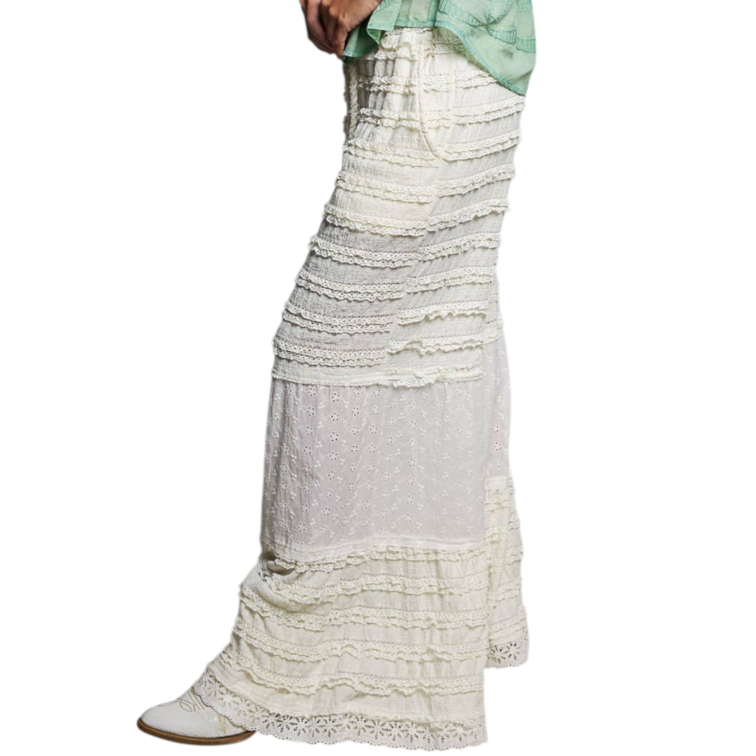 White lace skirt with a green top on a white background