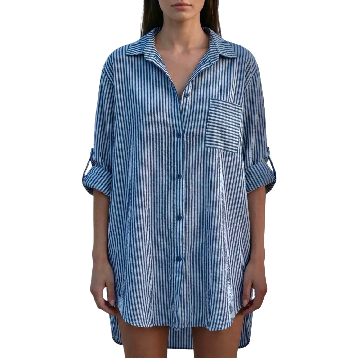 Woman wearing a blue and white striped shirt dress on a white background