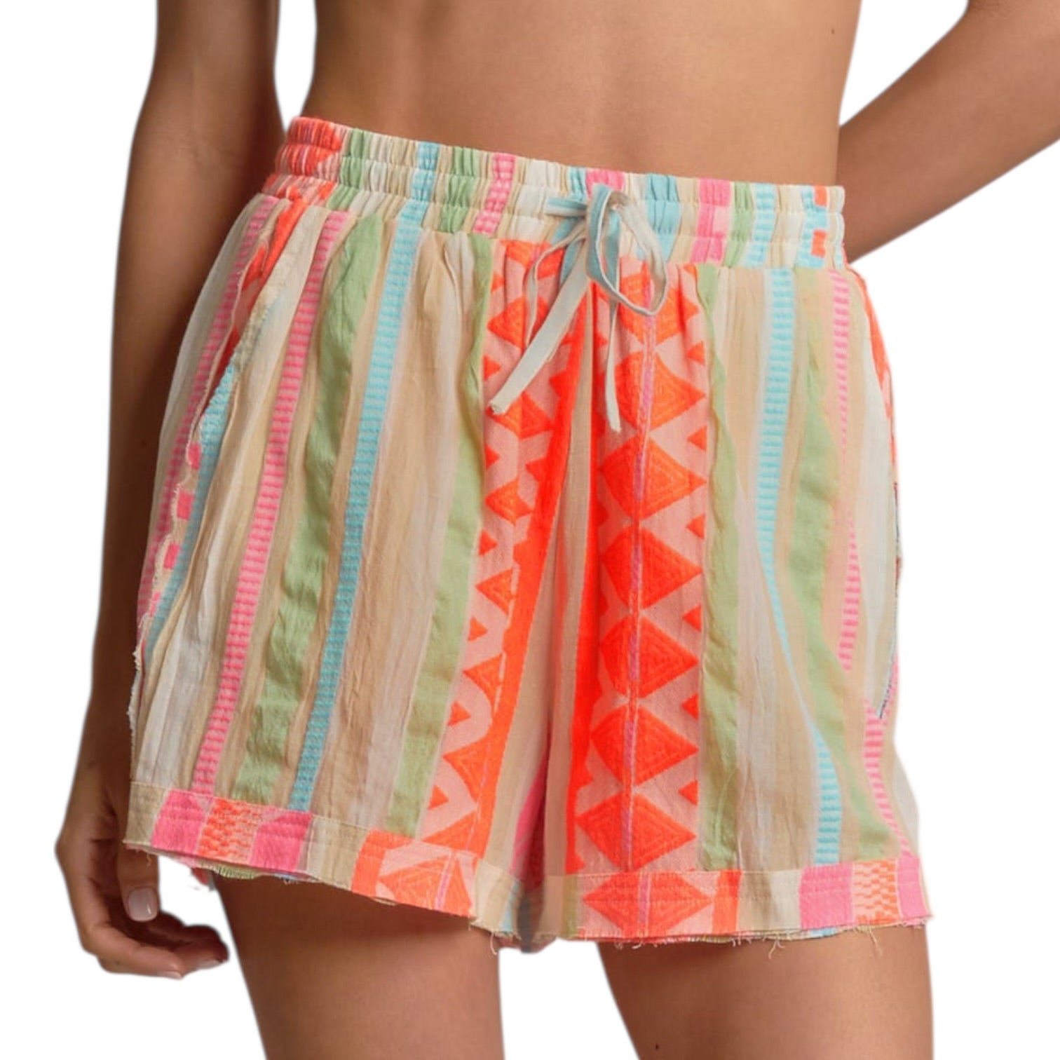 Colorful patterned shorts worn by a person on a white background
