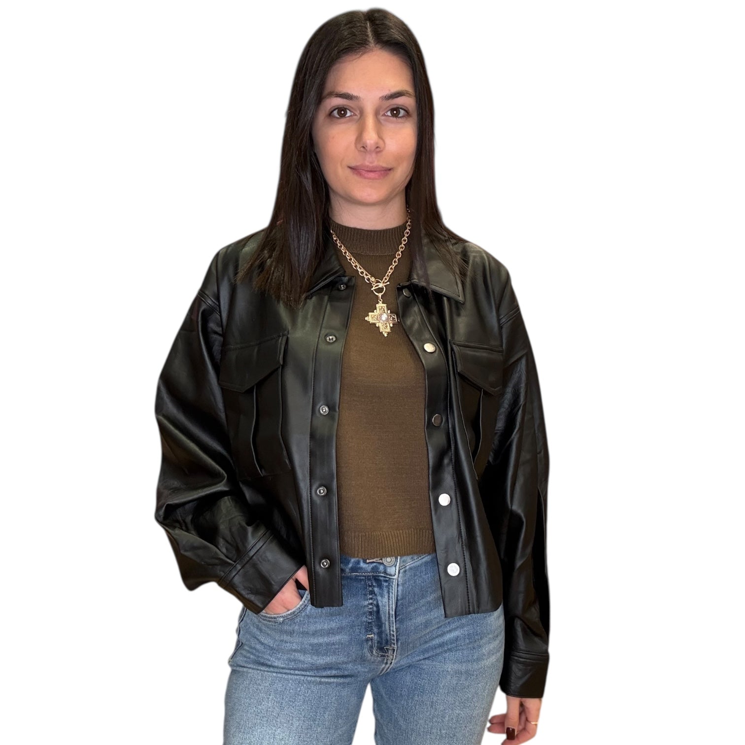 Woman wearing a black leather jacket over a olive shirt with blue jeans on a white background