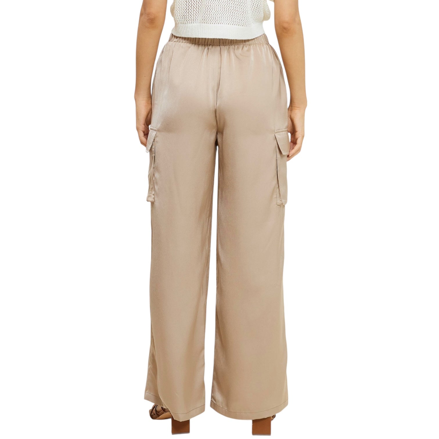 Nude cargo pants worn by a person on a white background