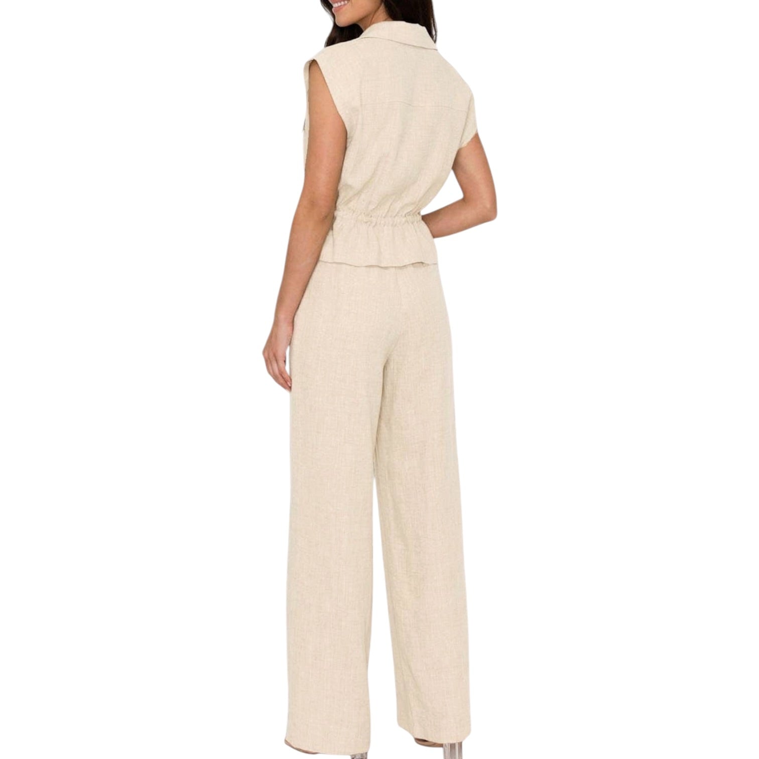 Beige set worn by a person on a white background