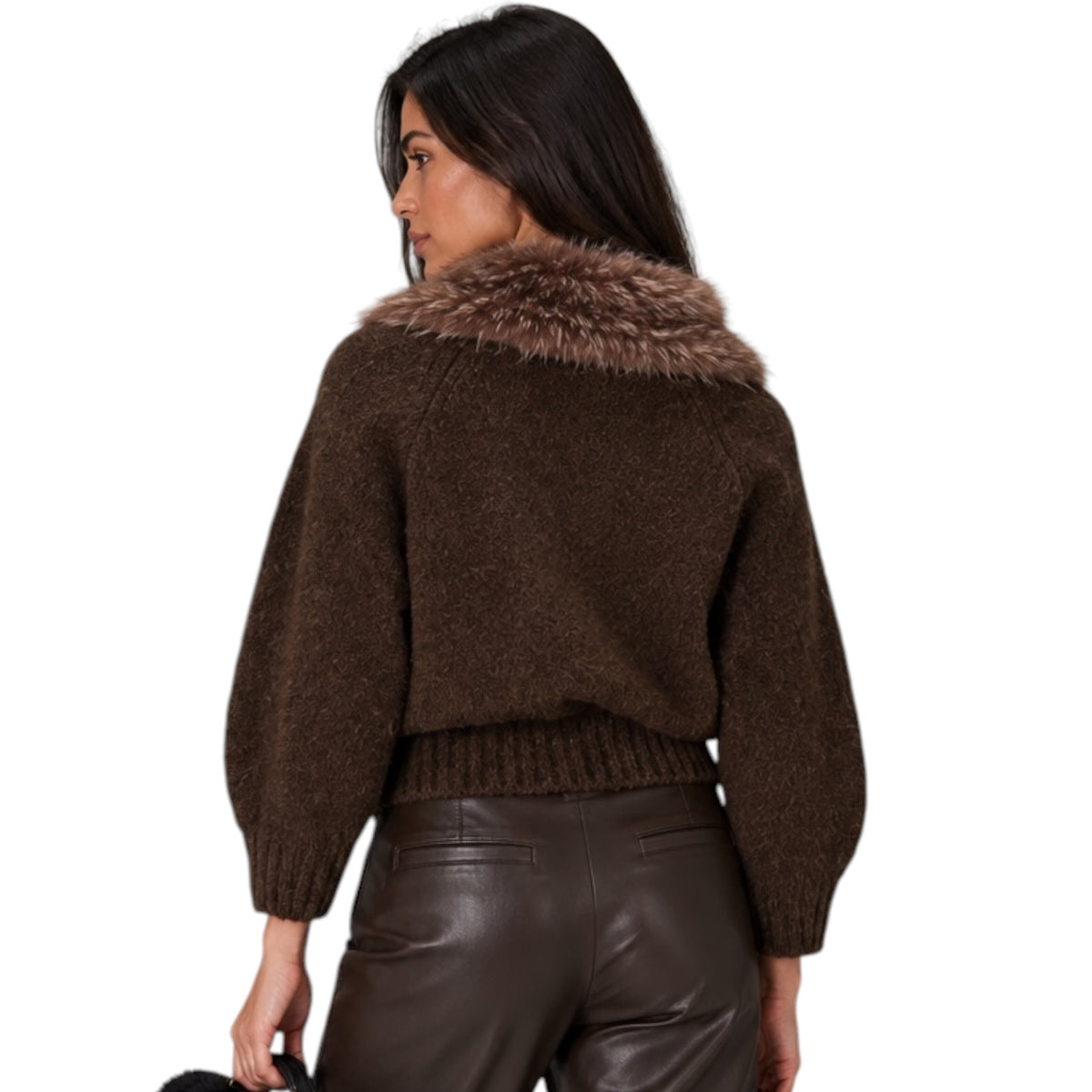 A woman shown from the back wearing a dark brown knit sweater with a brown faux-fur collar, paired with dark brown faux-leather pants, against a plain white background.