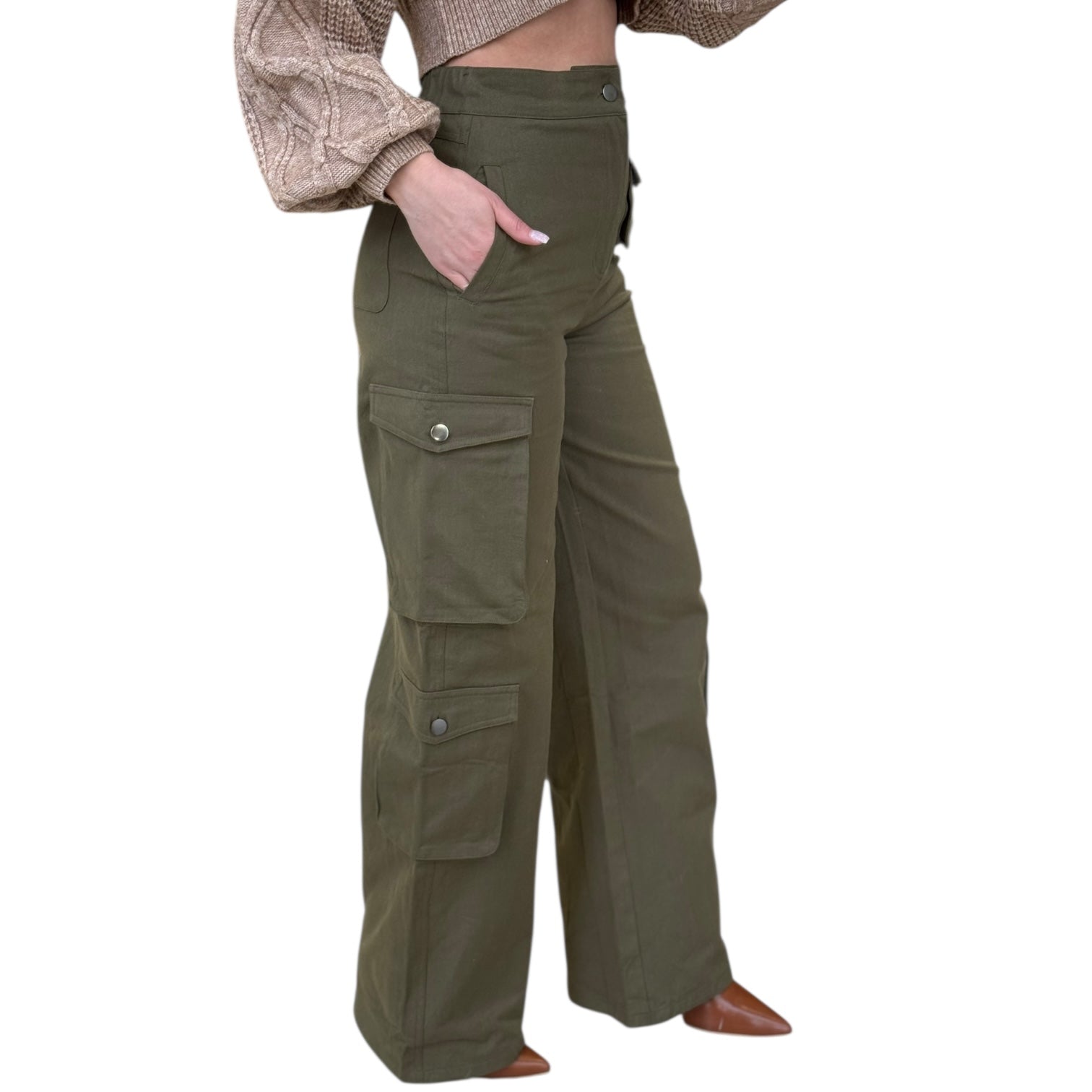 Green cargo pants worn by a person on a white background
