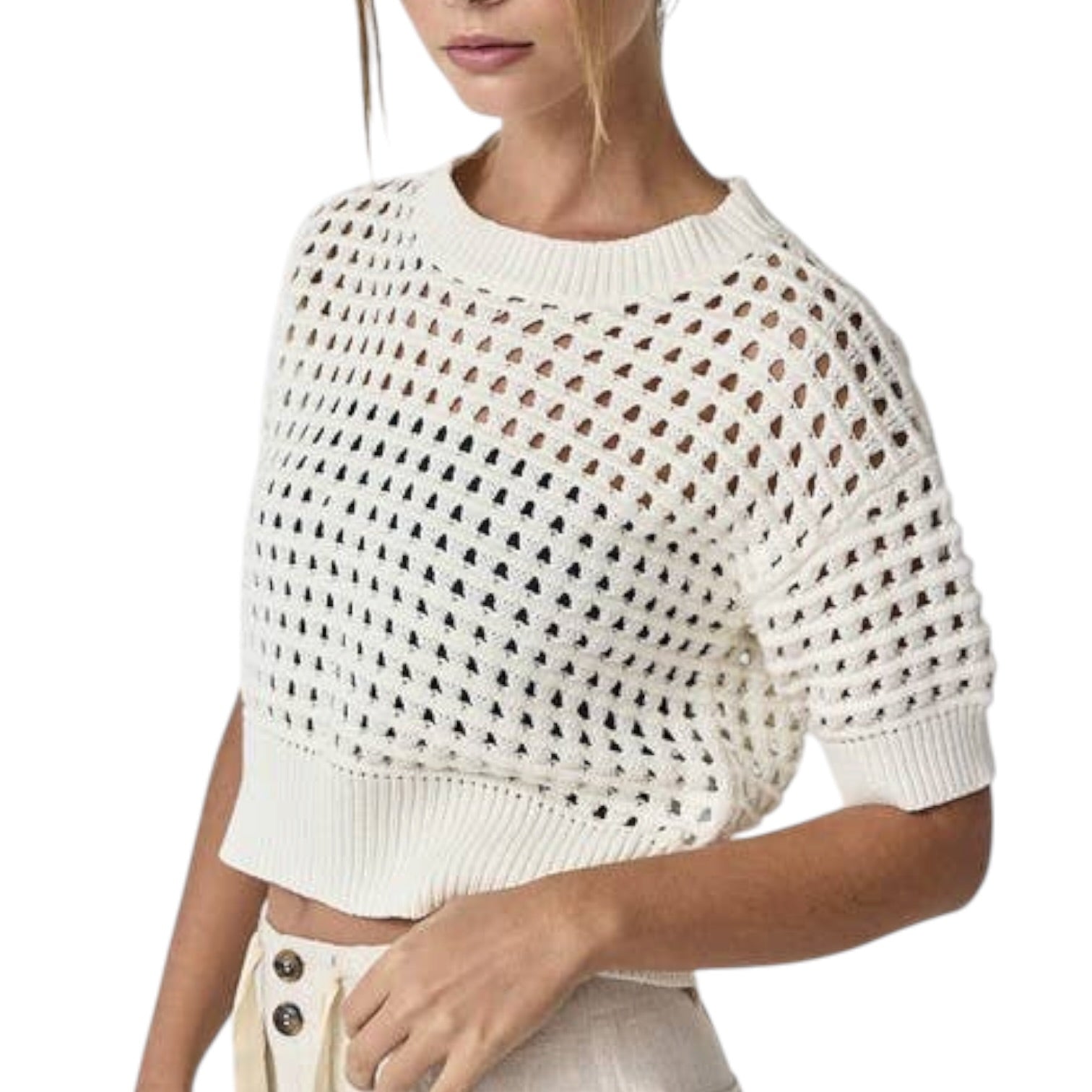 White open-knit sweater worn by a person on a white background