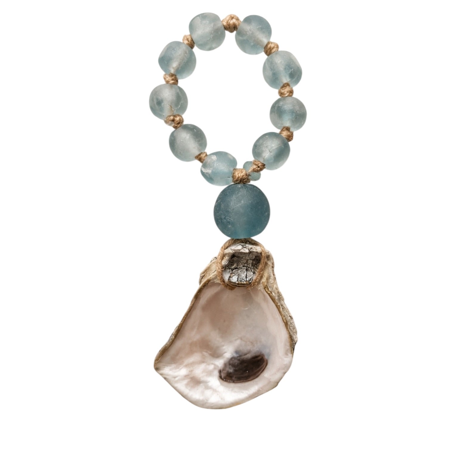 A beaded charm or keychain featuring light blue translucent gemstone beads, small gold spacer beads, a larger blue stone, and a natural oyster shell pendant on a gold cap, set against a plain white background.
