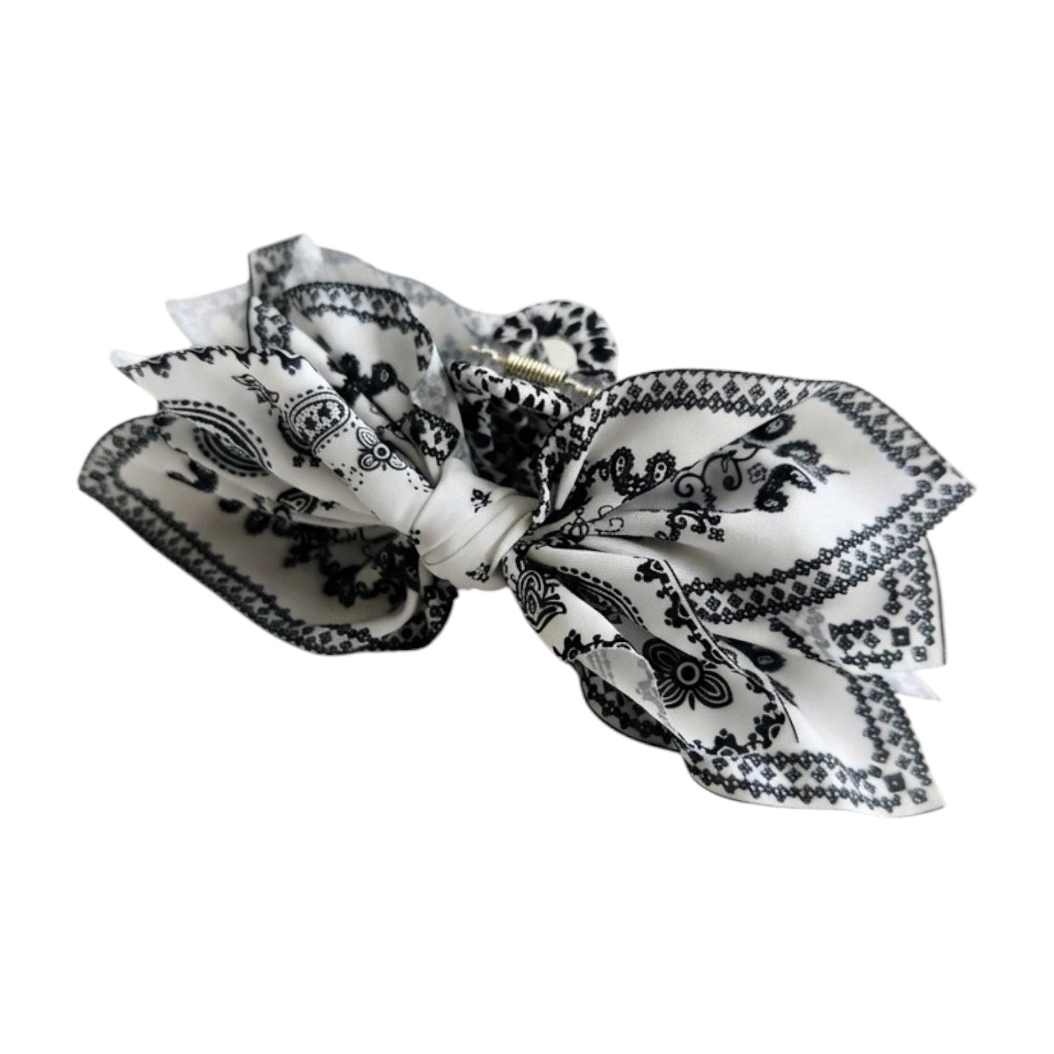 Black and white patterned hair bow on a white background