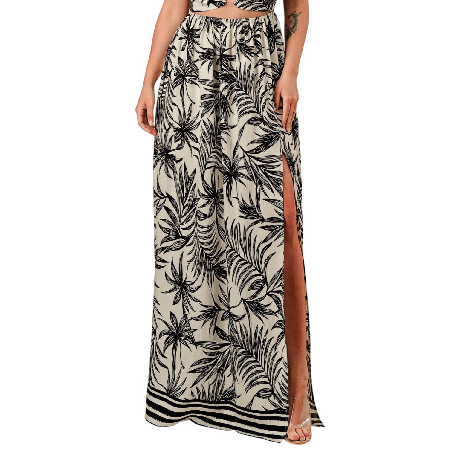 Tropical patterned maxi skirt with a side slit on a white background