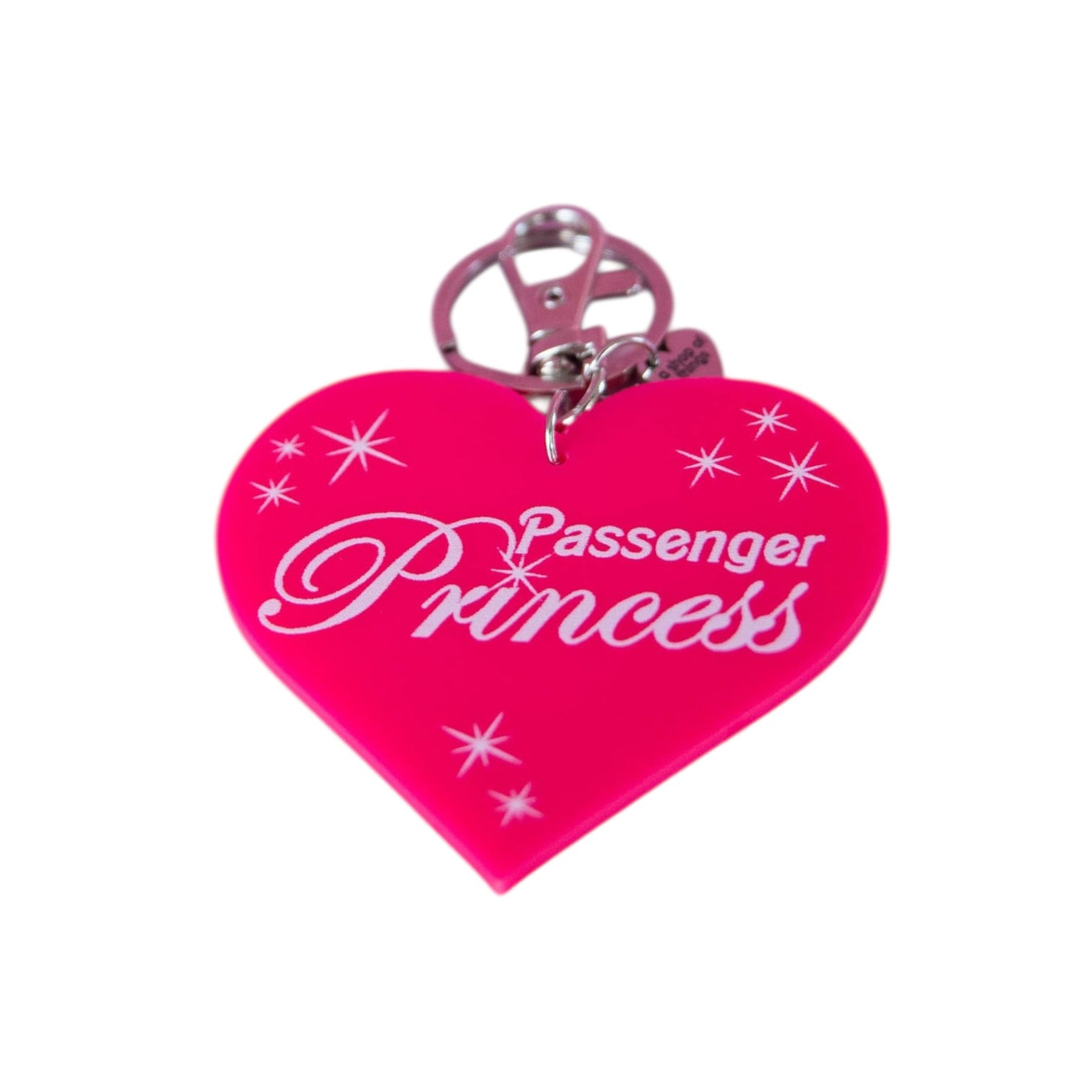 Pink heart-shaped keychain with 'Passenger Princess' text on a white background