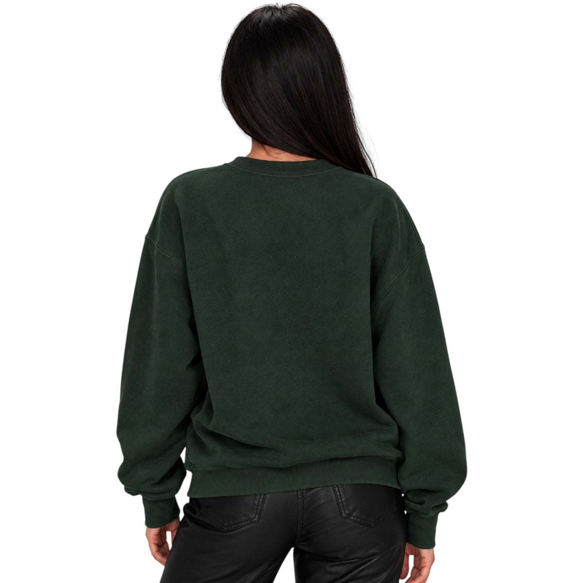 A woman viewed from the back wearing a dark forest green crewneck sweatshirt and black pants, set against a plain white background.