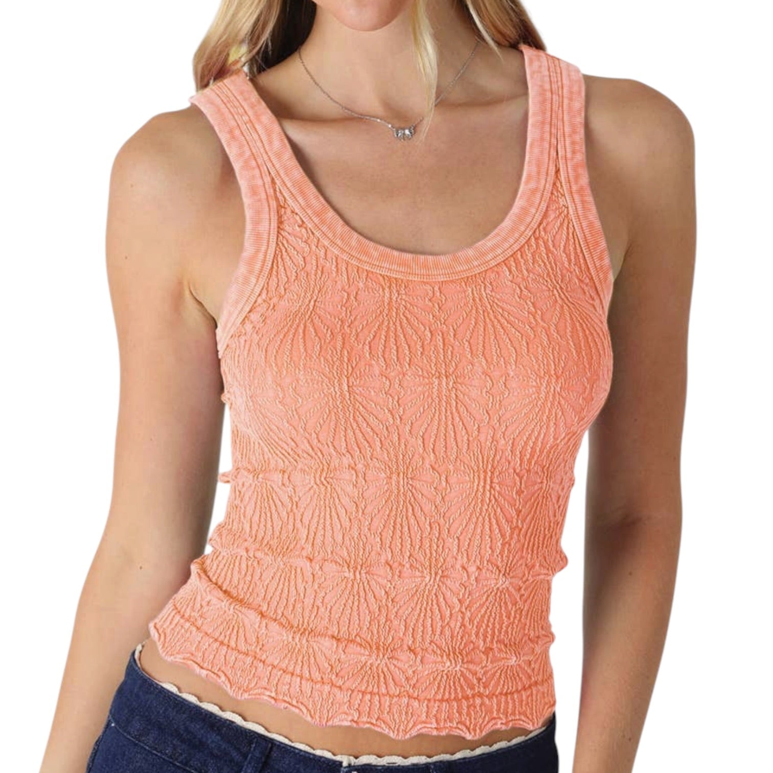Woman wearing a pink textured tank top on a white background