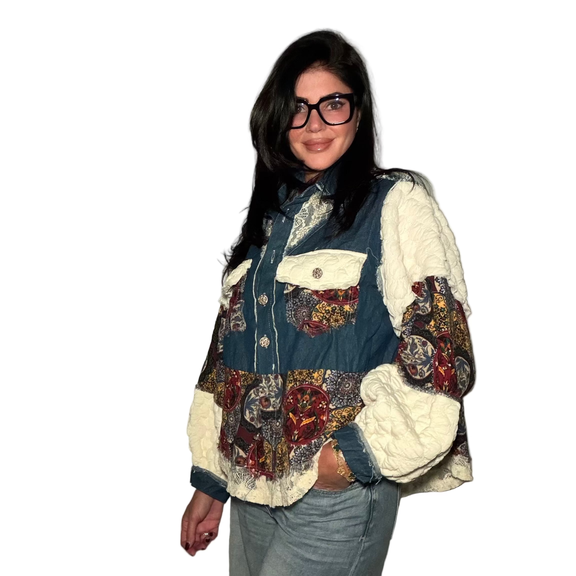 Person wearing a patchwork jacket with a neutral background
