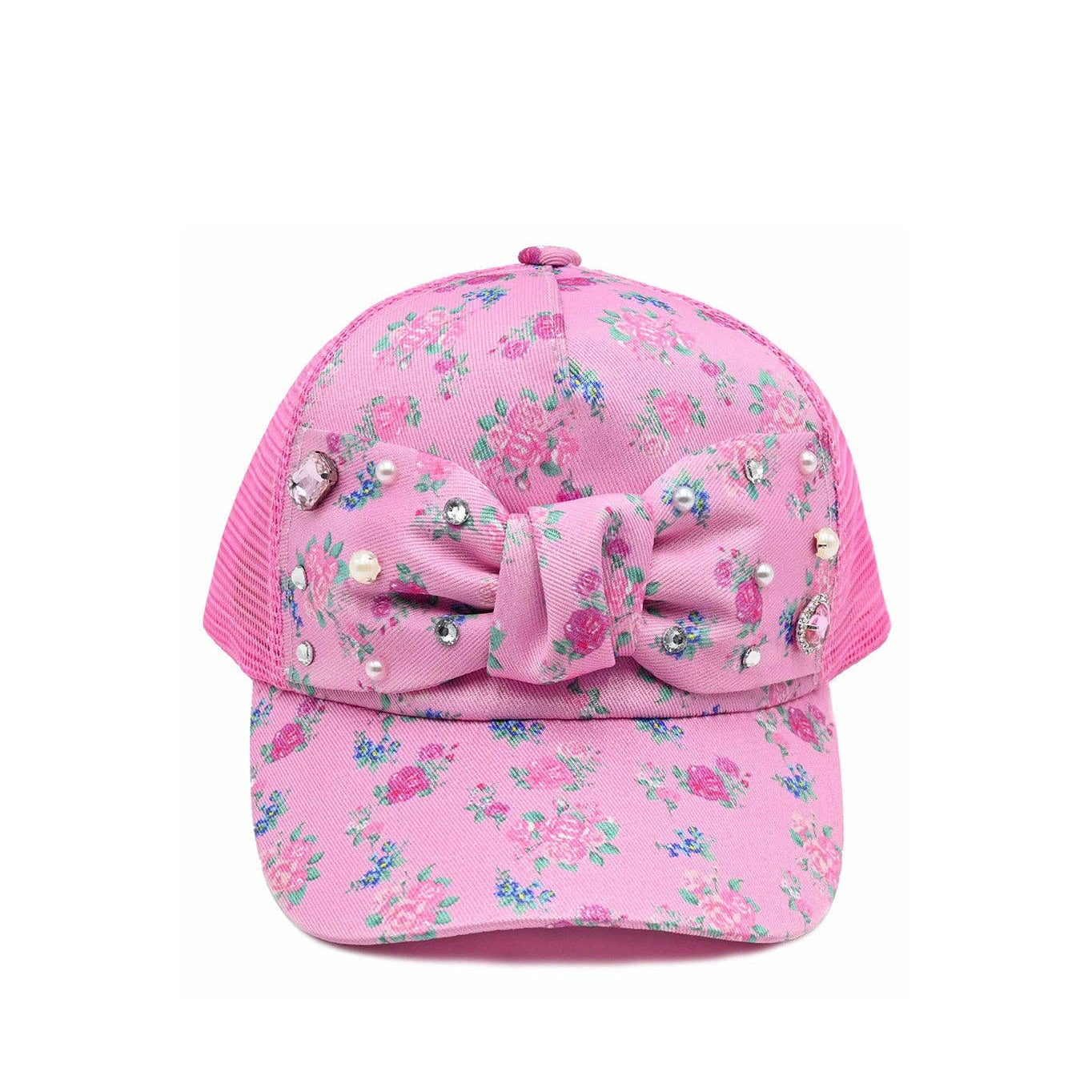 Pink floral cap with a bow and embellishments on a white background