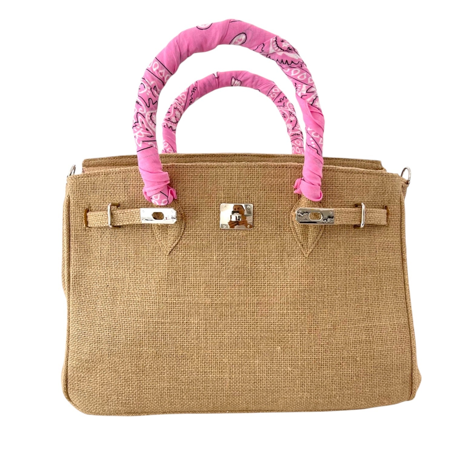 Brown handbag with pink patterned handles on a white background