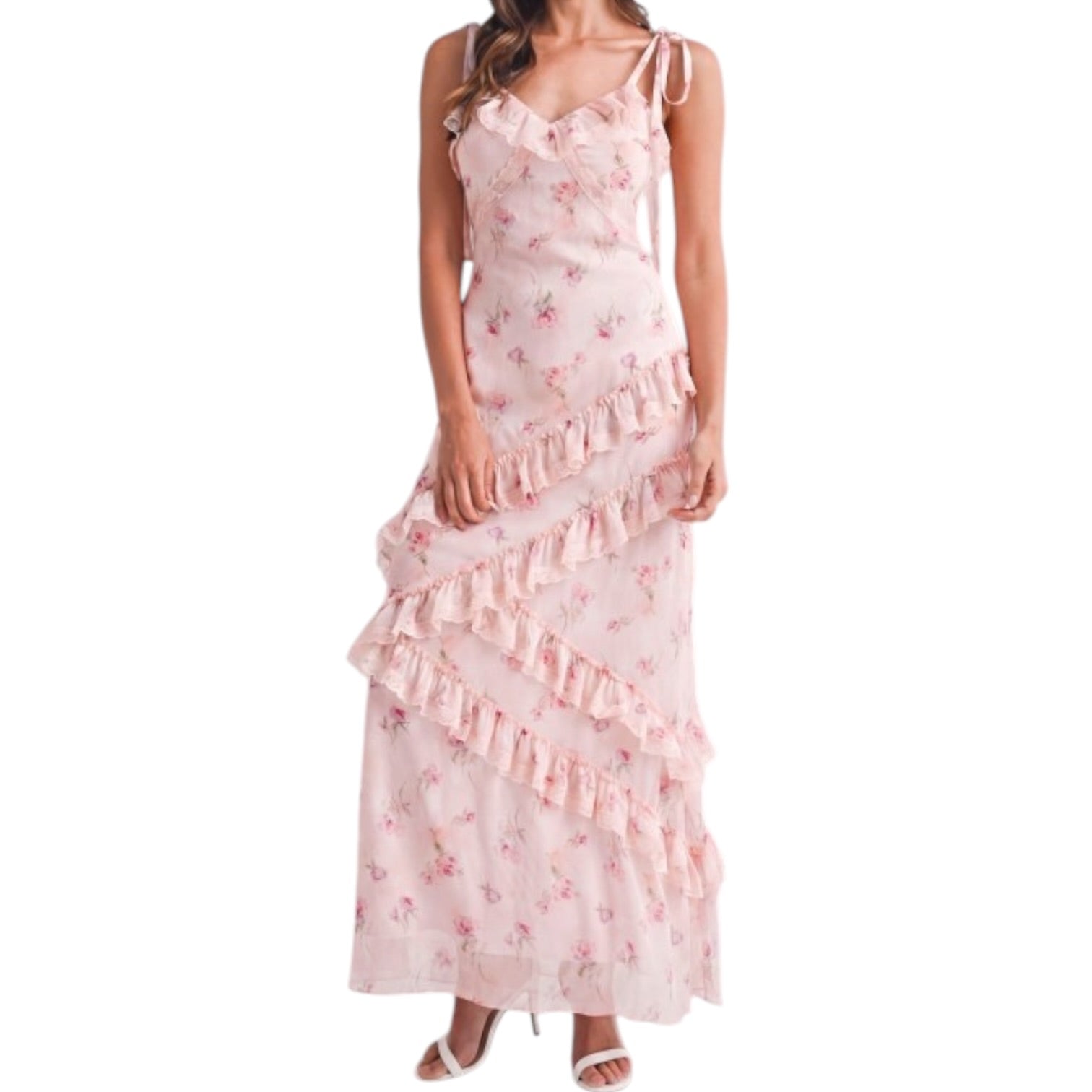a woman wearing a pink floral dress with ruffles on white background