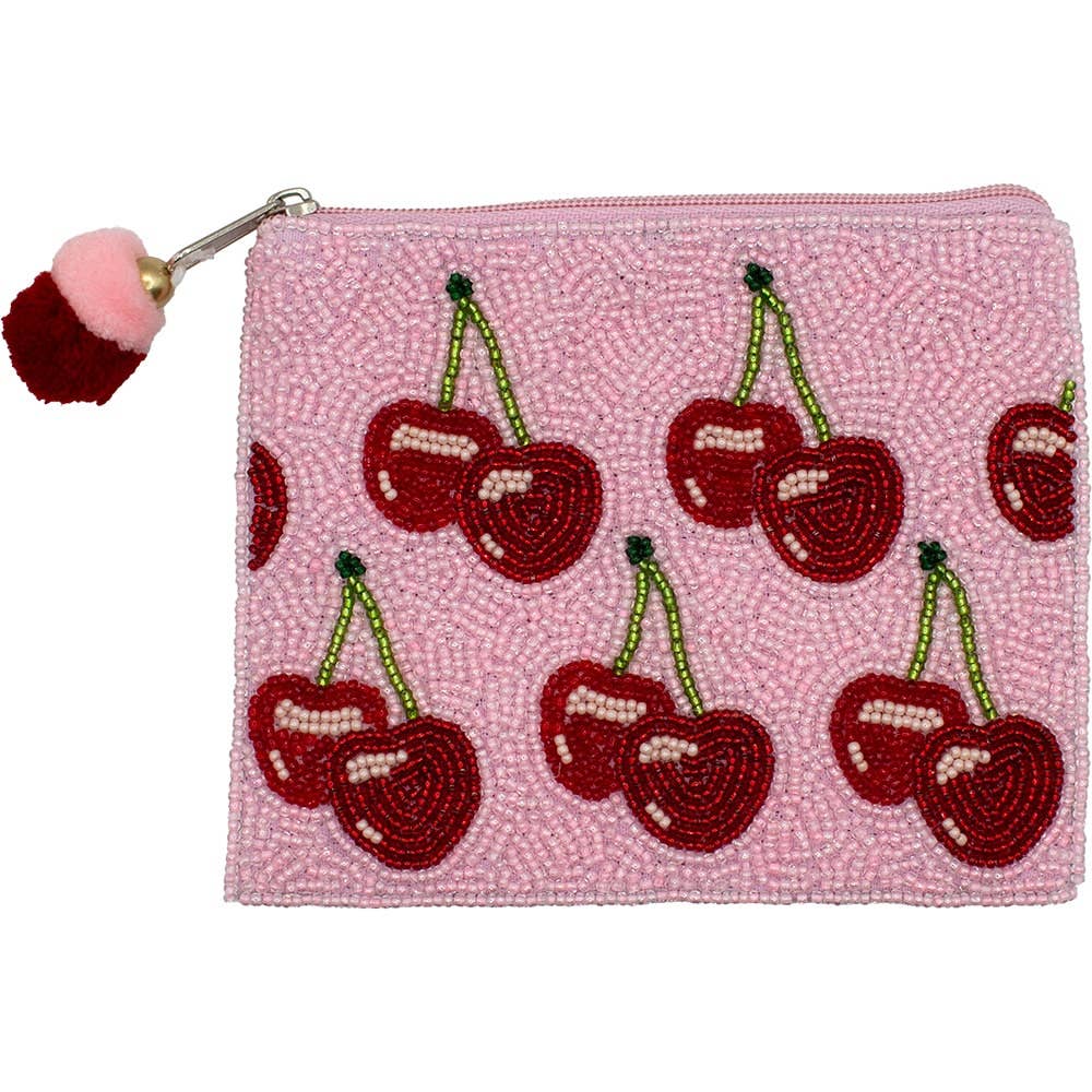 Pink beaded pouch with cherry design and pom-pom on a white background