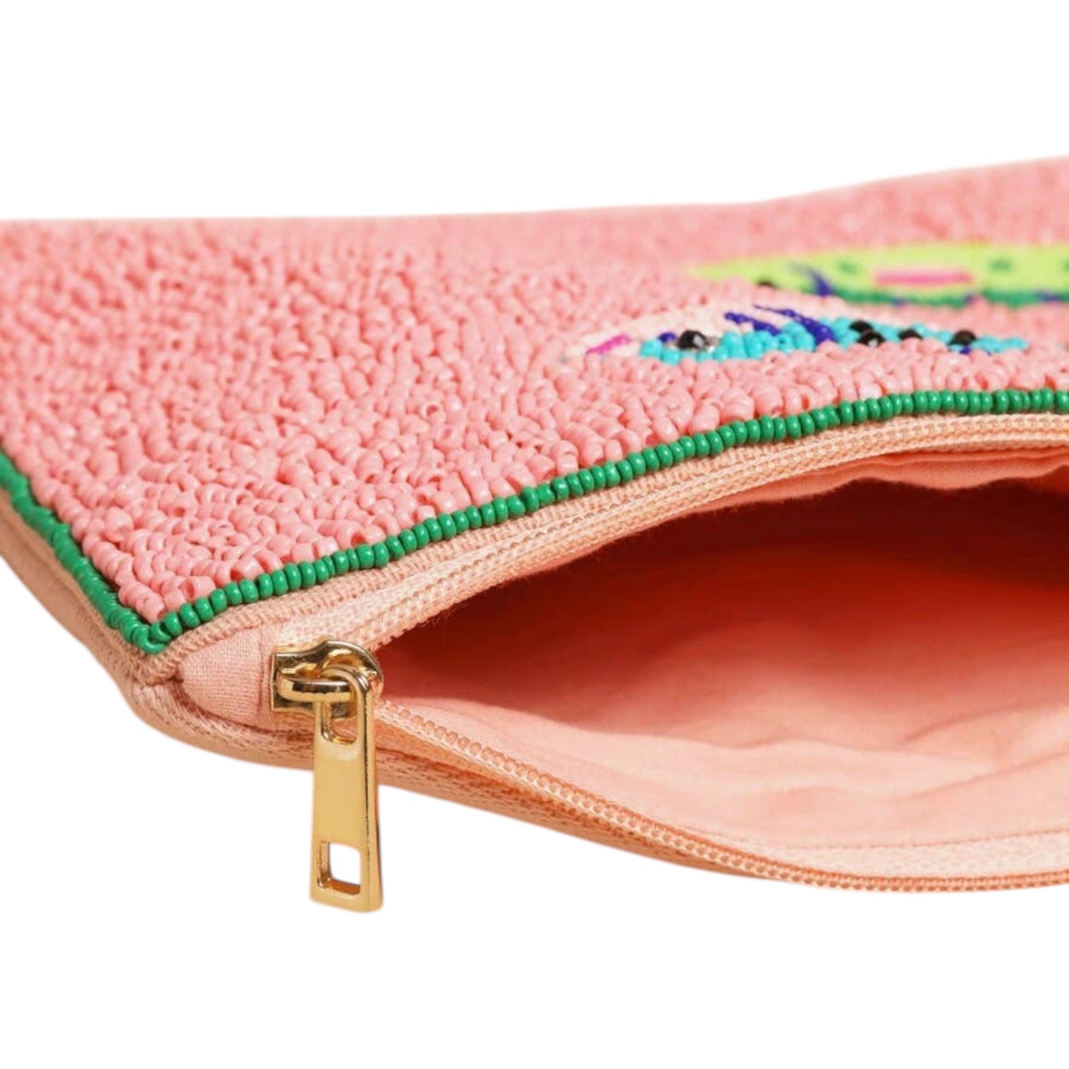 Pink pouch with colorful embroidered design and gold zipper on a white background