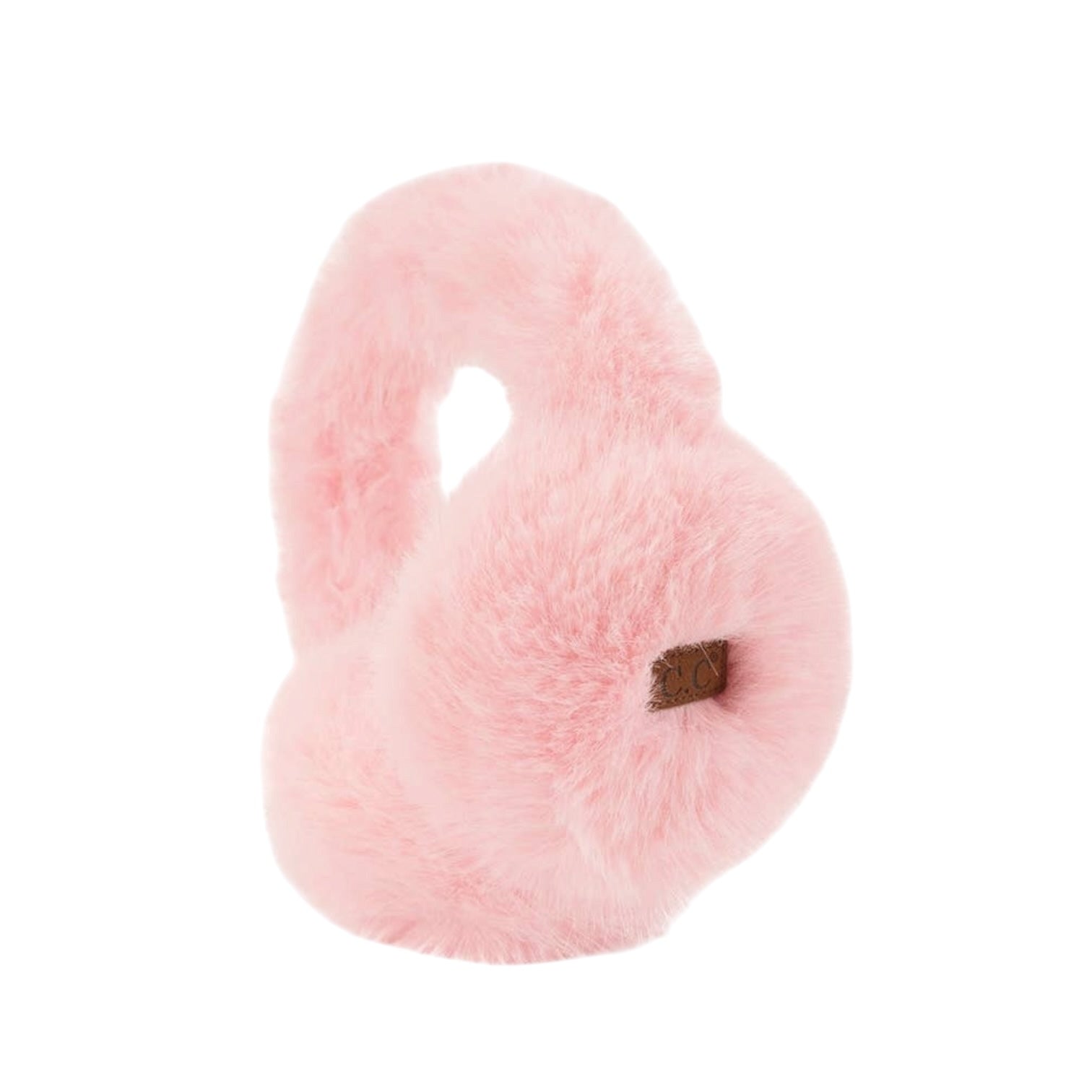A light pink fluffy faux-fur heart-shaped dog toy with a small brown tag on the front, isolated on a white background.