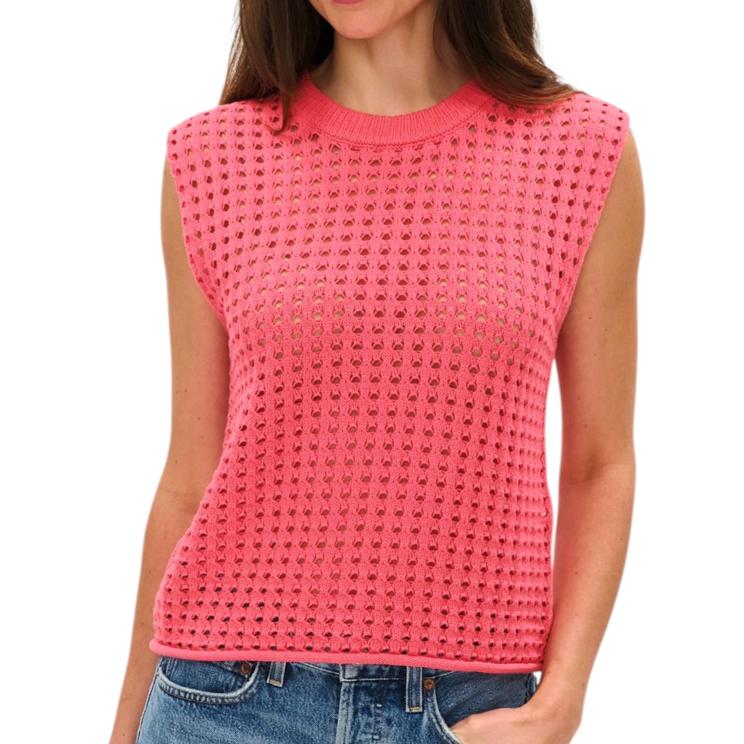 Woman wearing a pink sleeveless crochet top on a white background