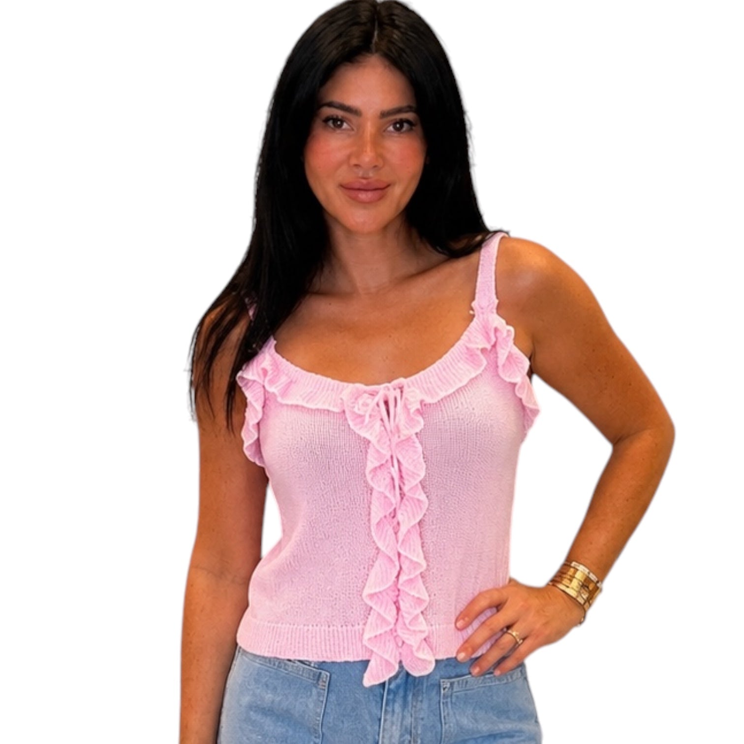 Woman wearing a pink ruffled top on a white background