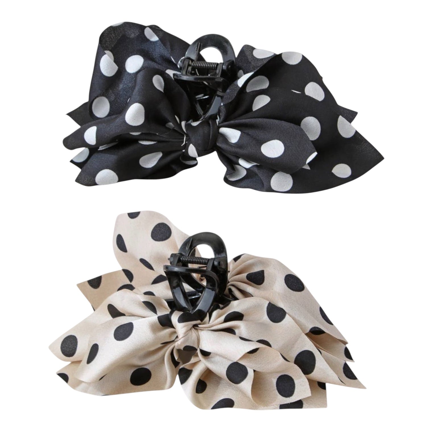 Two large fabric hair claw clips shown on a plain white background, one in black with white polka dots and one in beige with black polka dots.