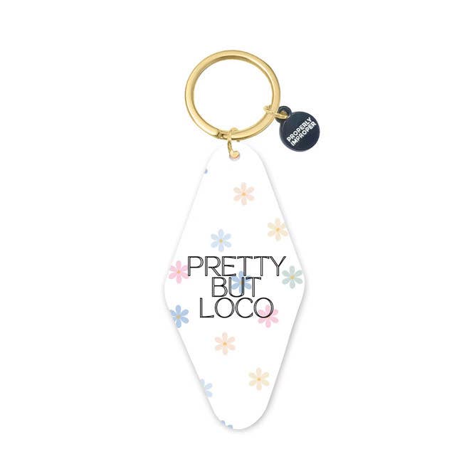 Keychain with 'Pretty But Loco' text and floral designs on a white background