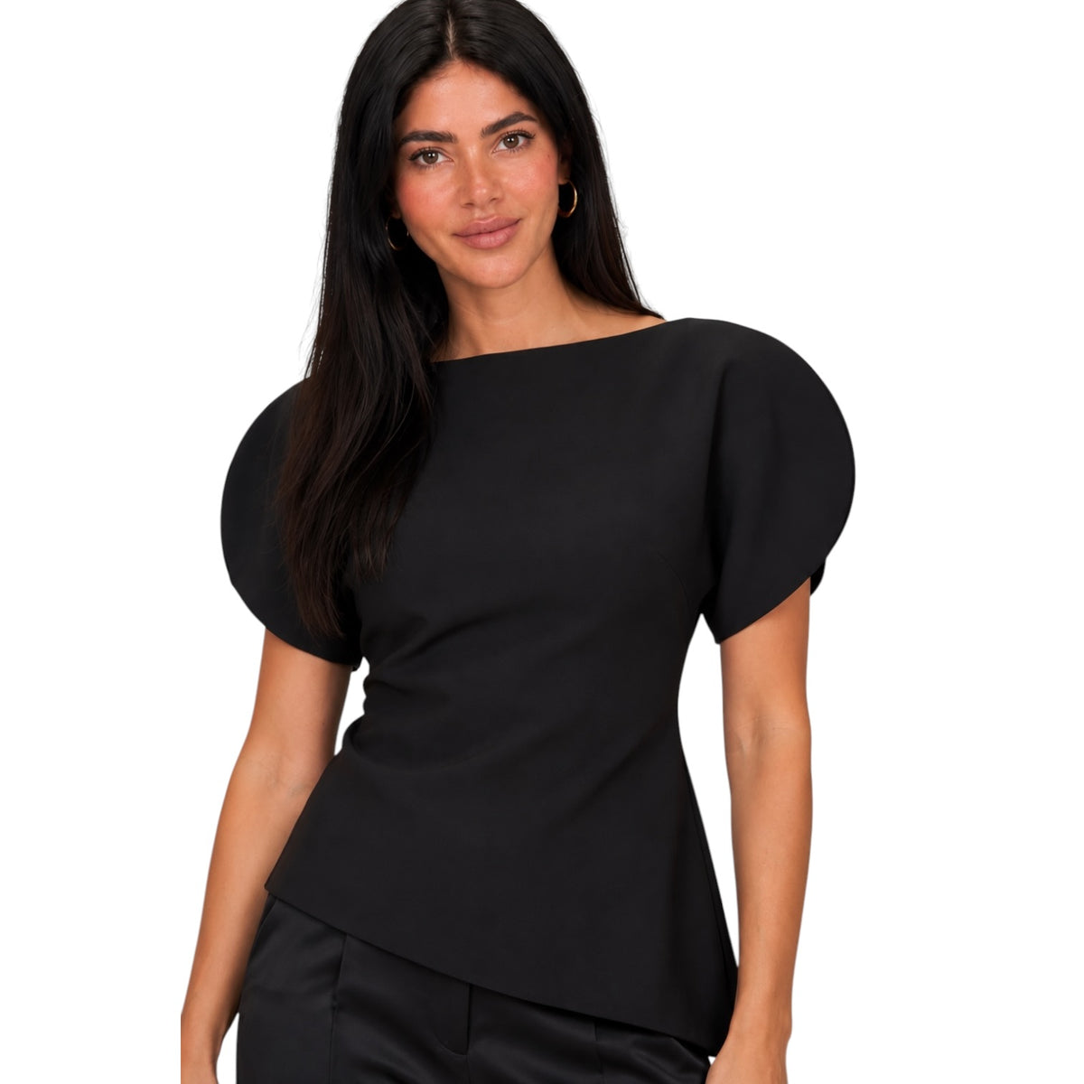 A woman modeling a black short-sleeve top with puffed cap sleeves and a boat neckline, paired with black trousers, against a plain white background.