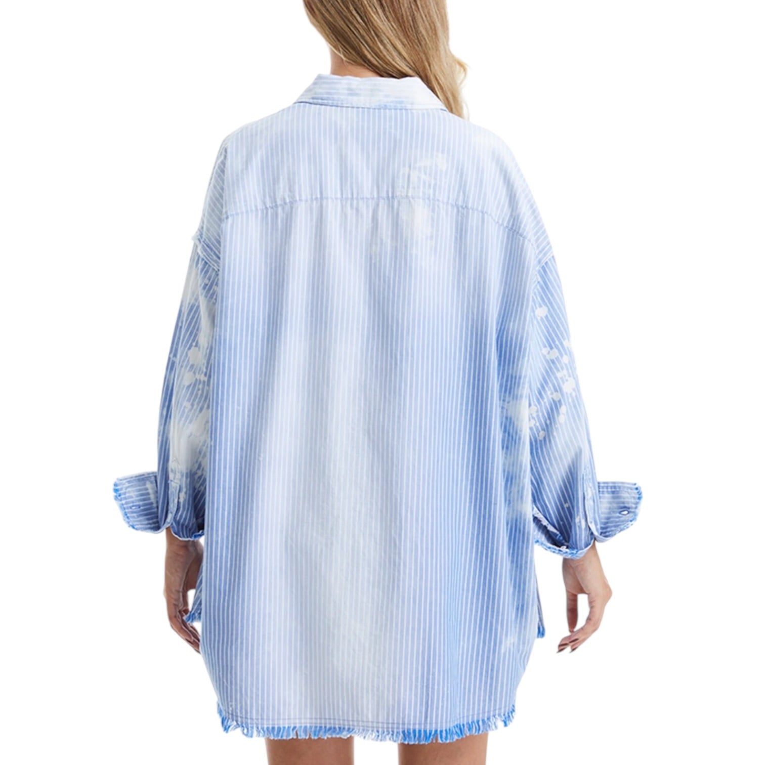 Woman wearing a blue and white striped shirt dress on a white background