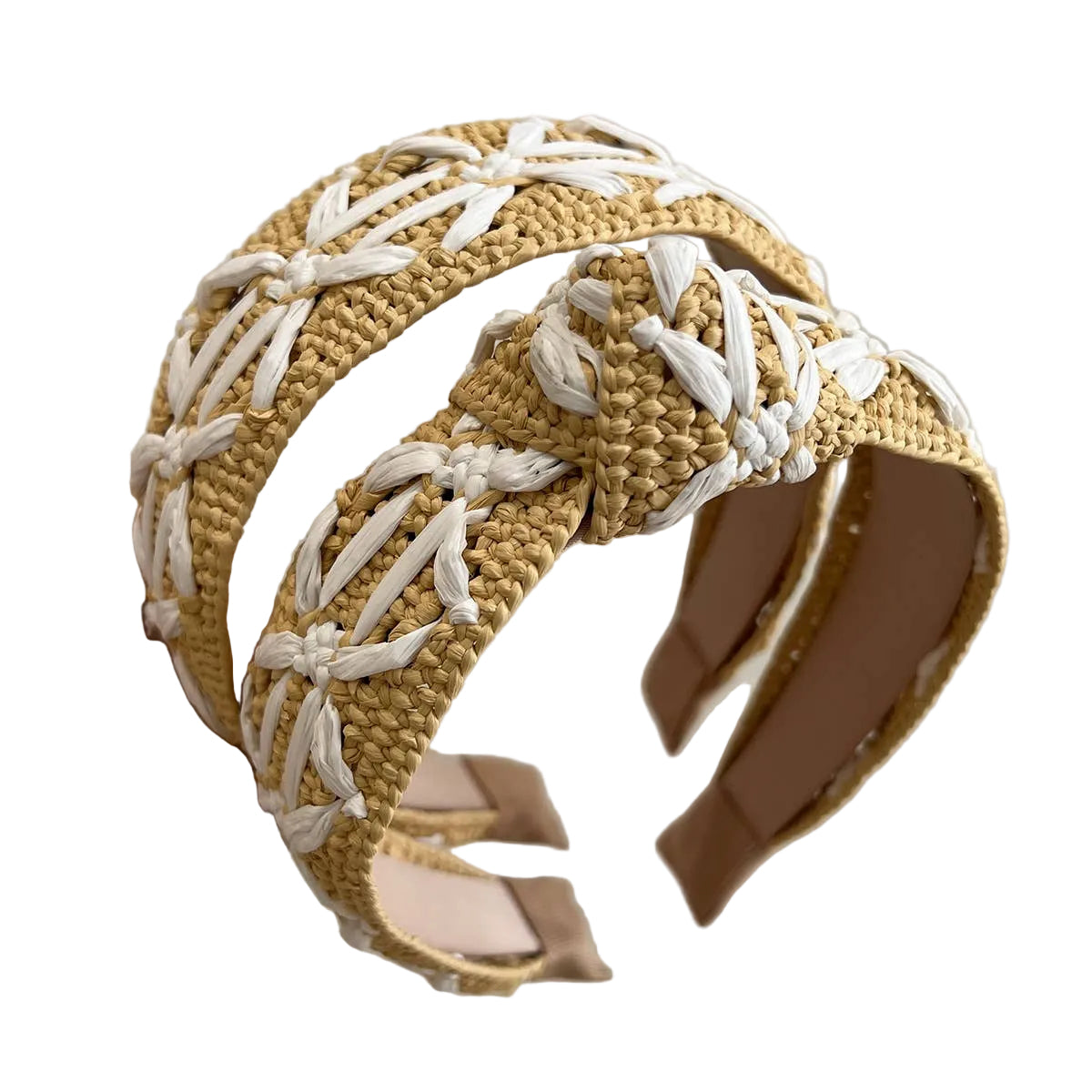Woven headband with beige and white pattern held by a hand against a neutral background